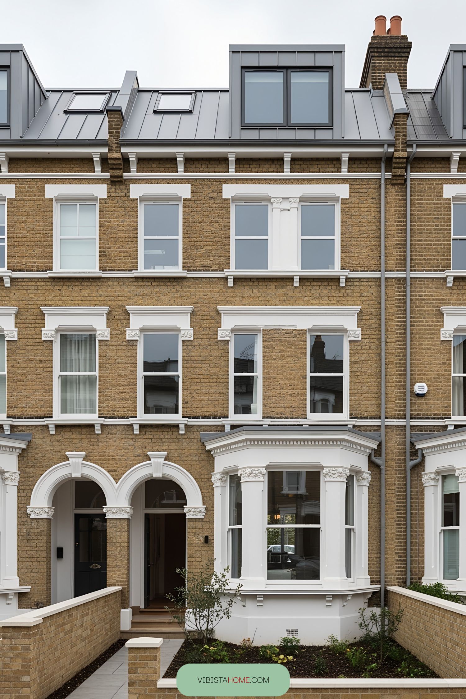 Classic Victorian terrace facade with brick and white accents