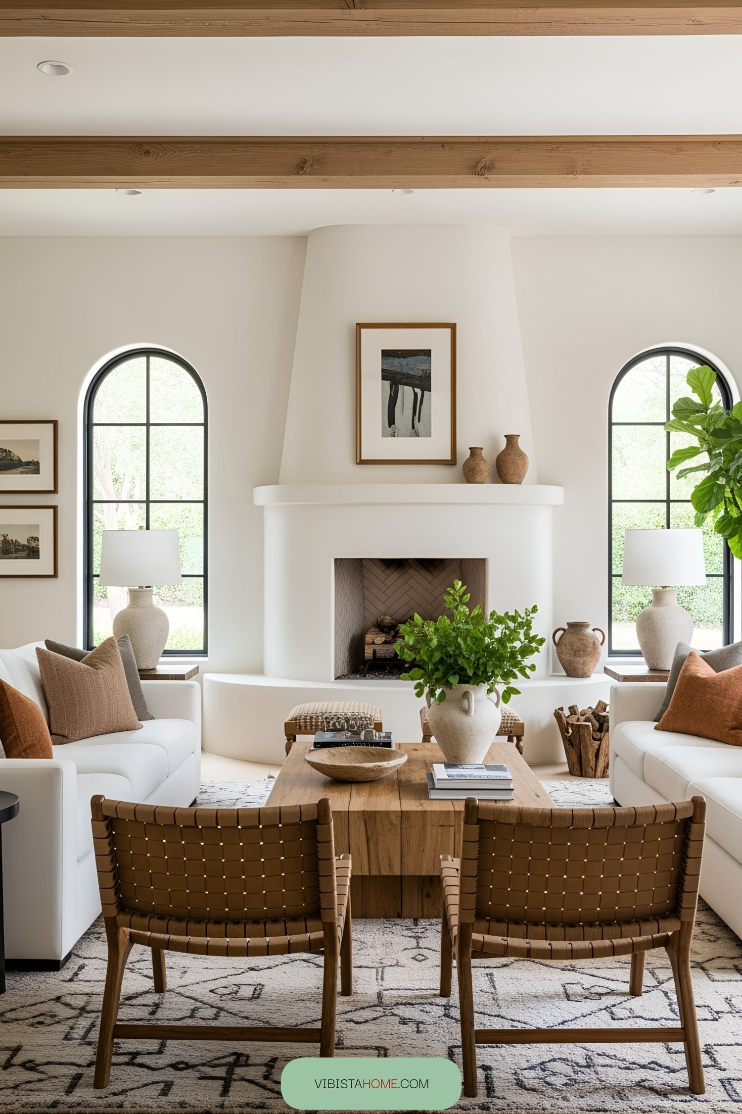 Living room with arched windows and cozy fireplace
