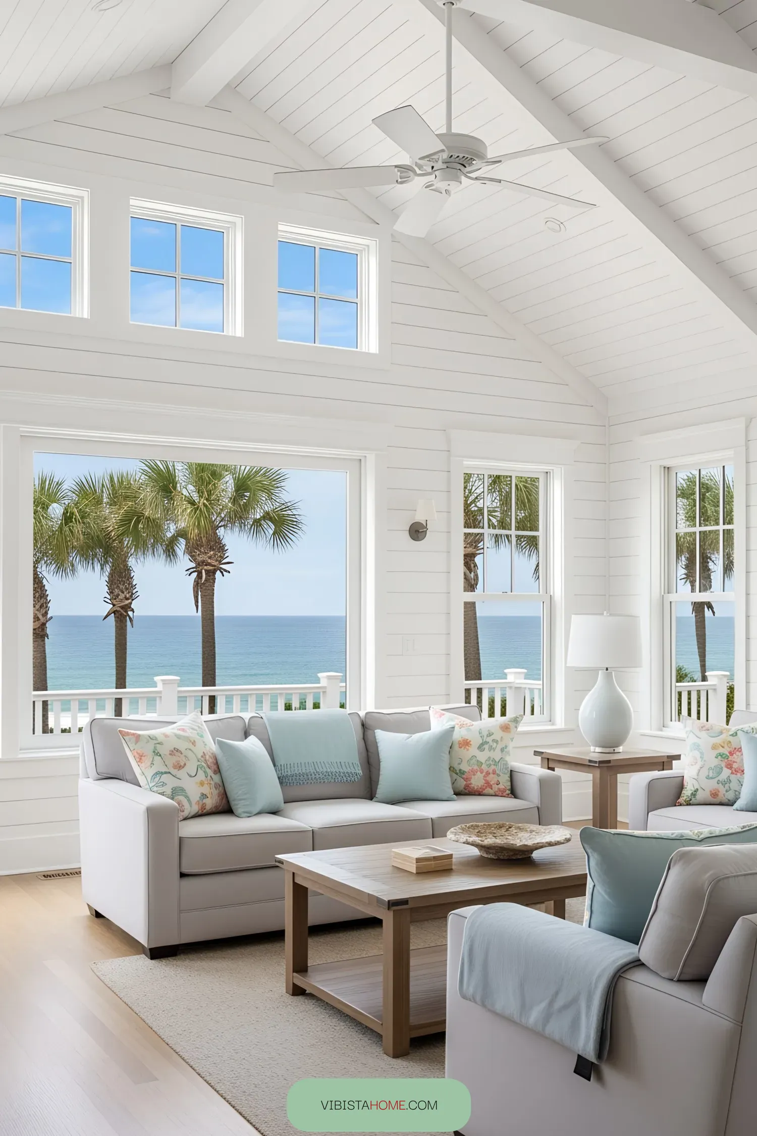 Bright beach house living room with ocean view