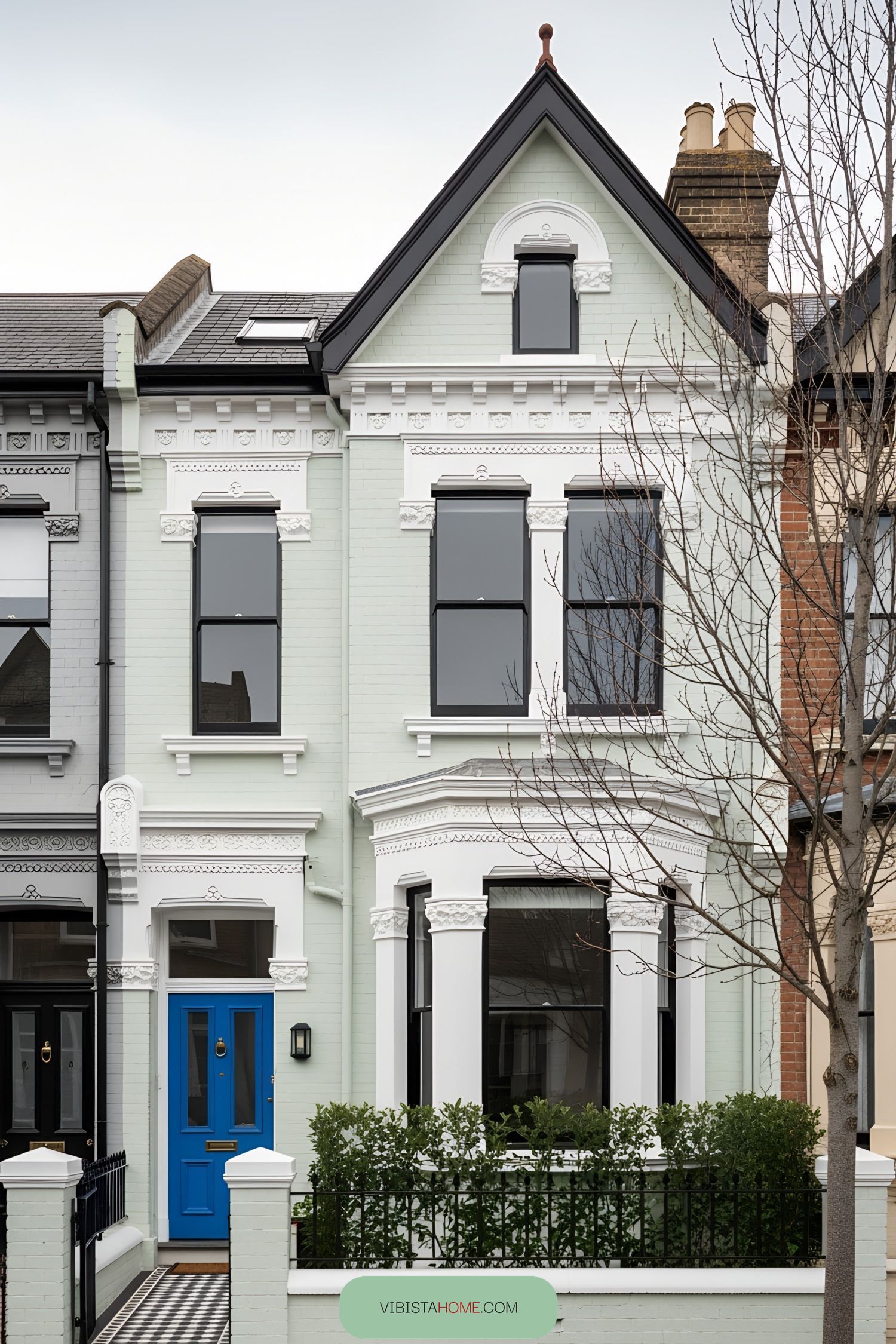 Victorian terrace with a bright blue door and ornate details