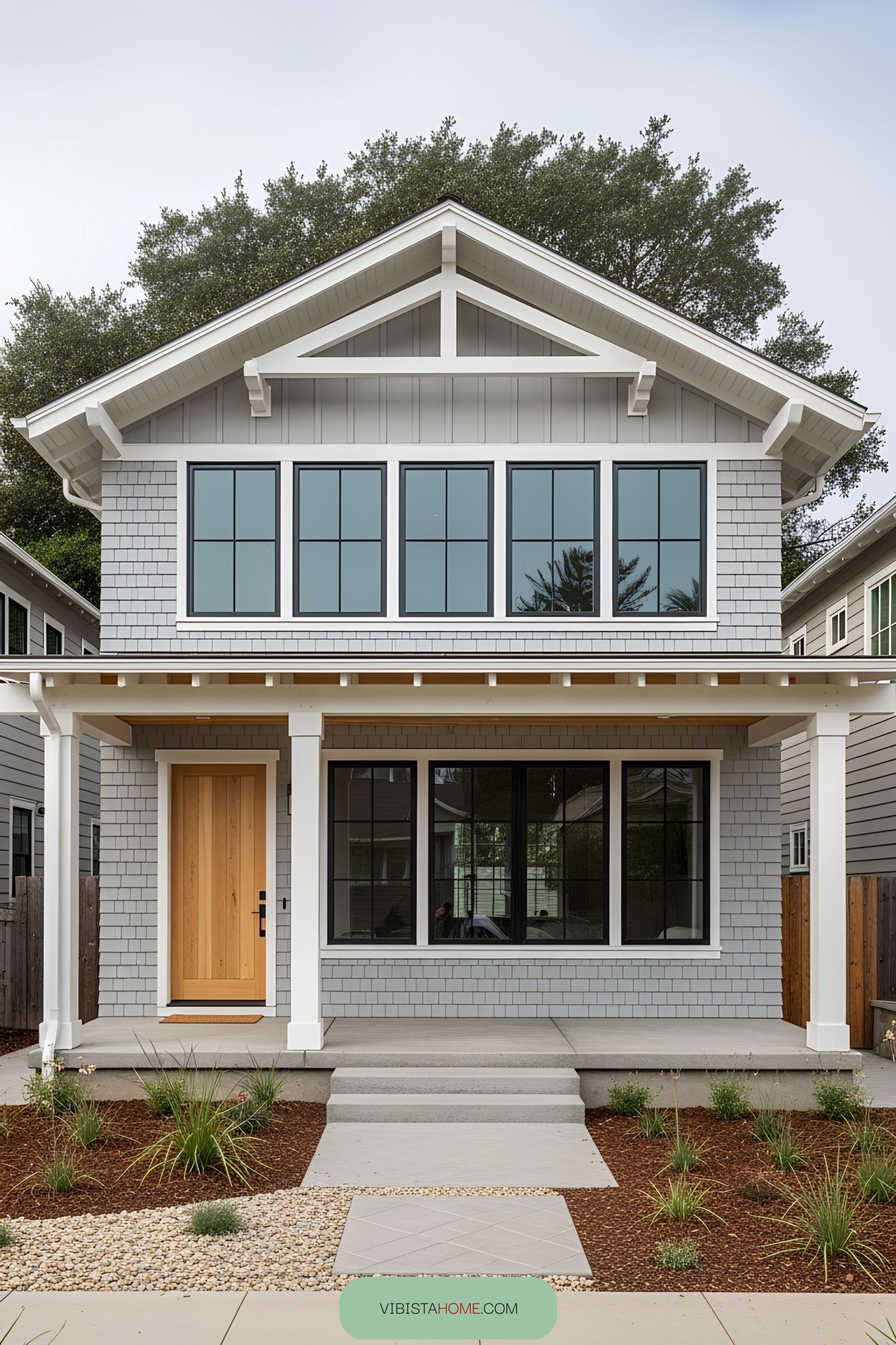 Modern two-story coastal bungalow with large windows