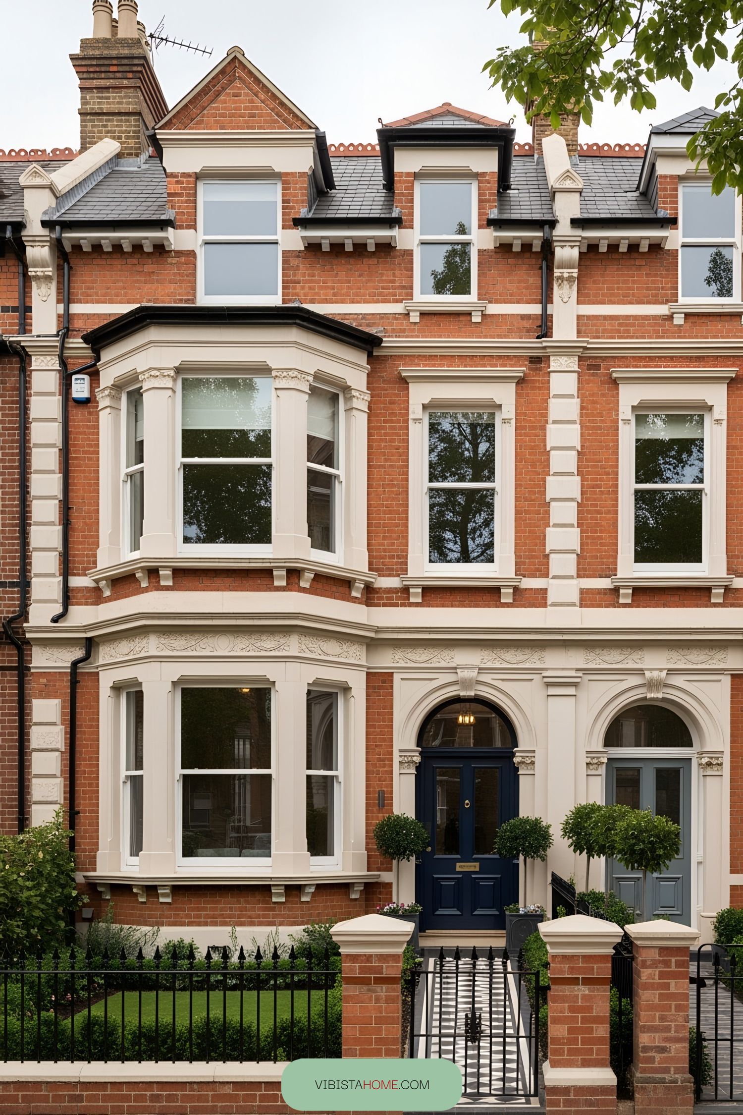 Victorian terrace house with ornate details and lush greenery