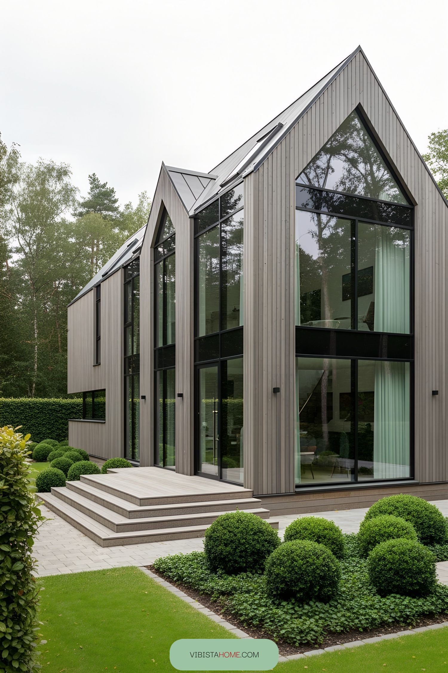 Modern Scandinavian farmhouse with large windows and angular roof