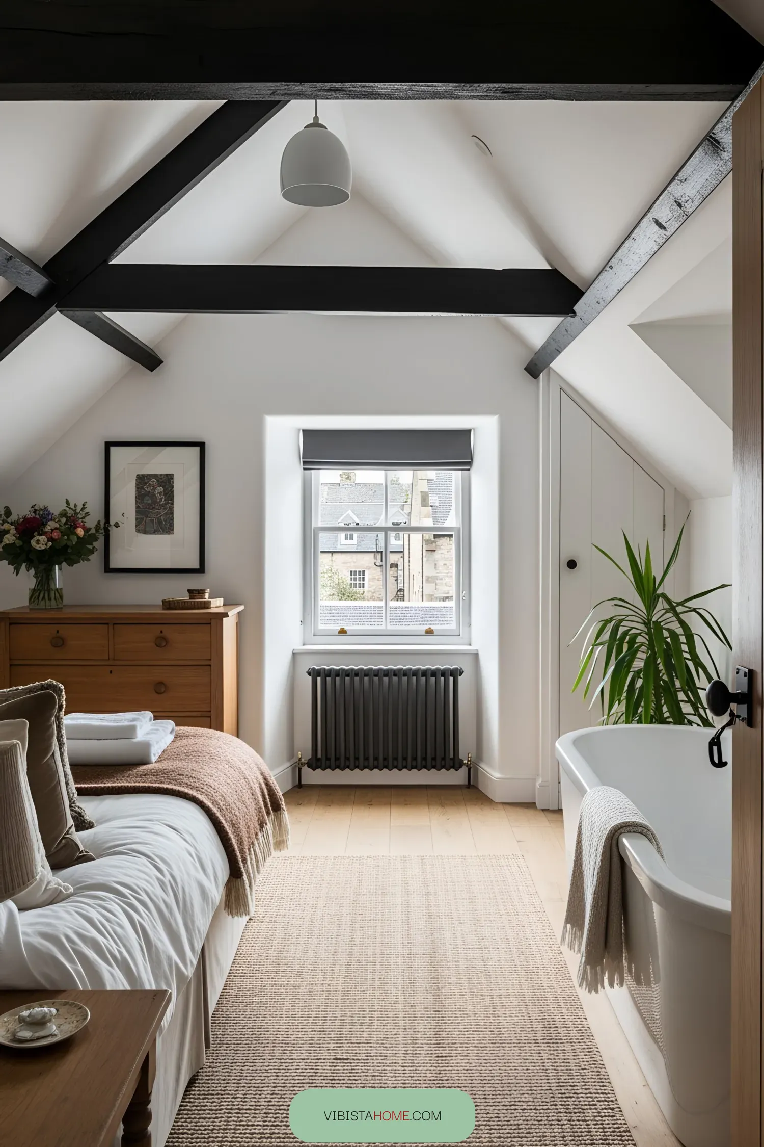Cozy cottage bedroom with exposed beams and a bathtub