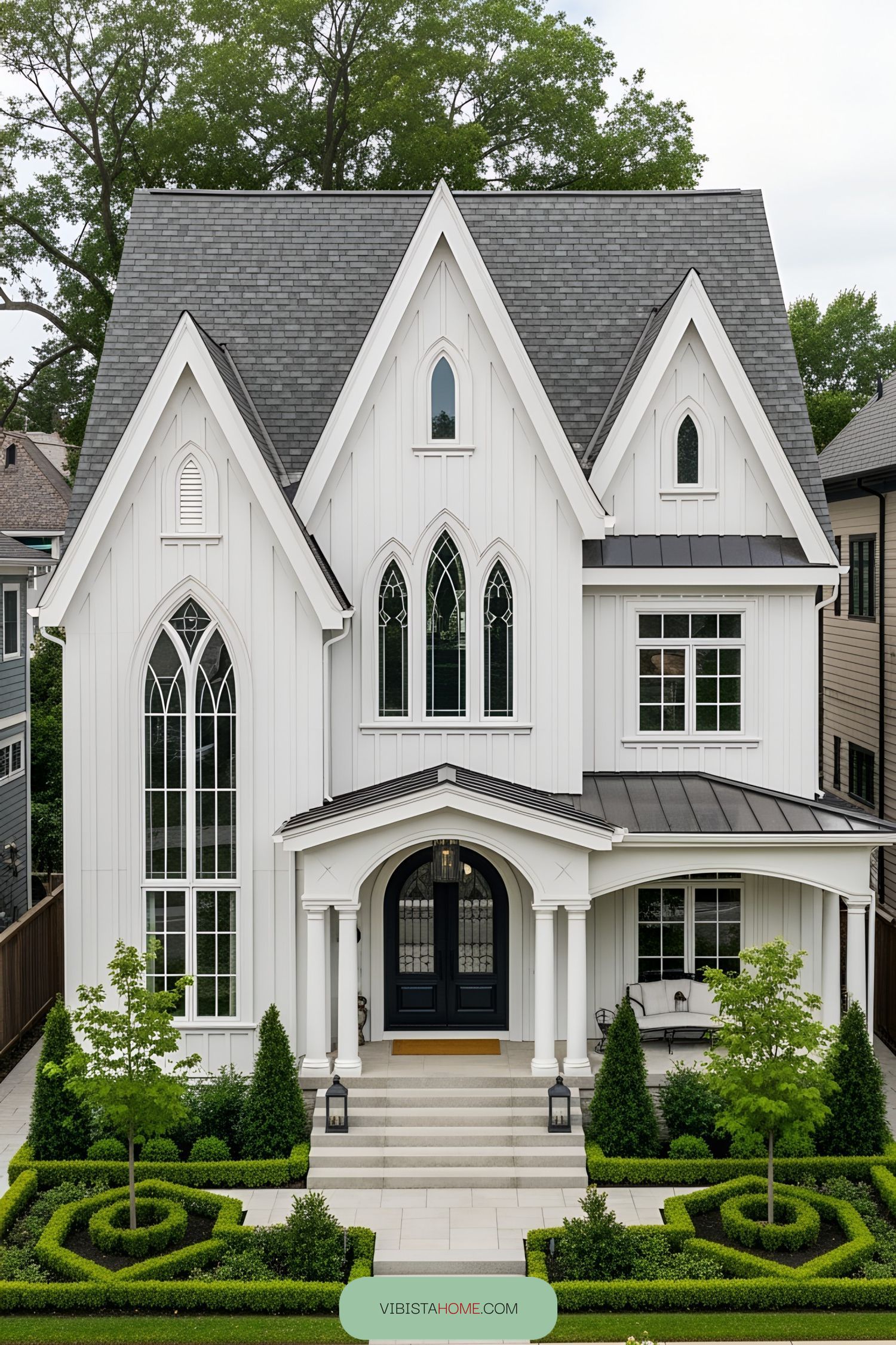 Elegant Victorian home with pointed arches and manicured garden