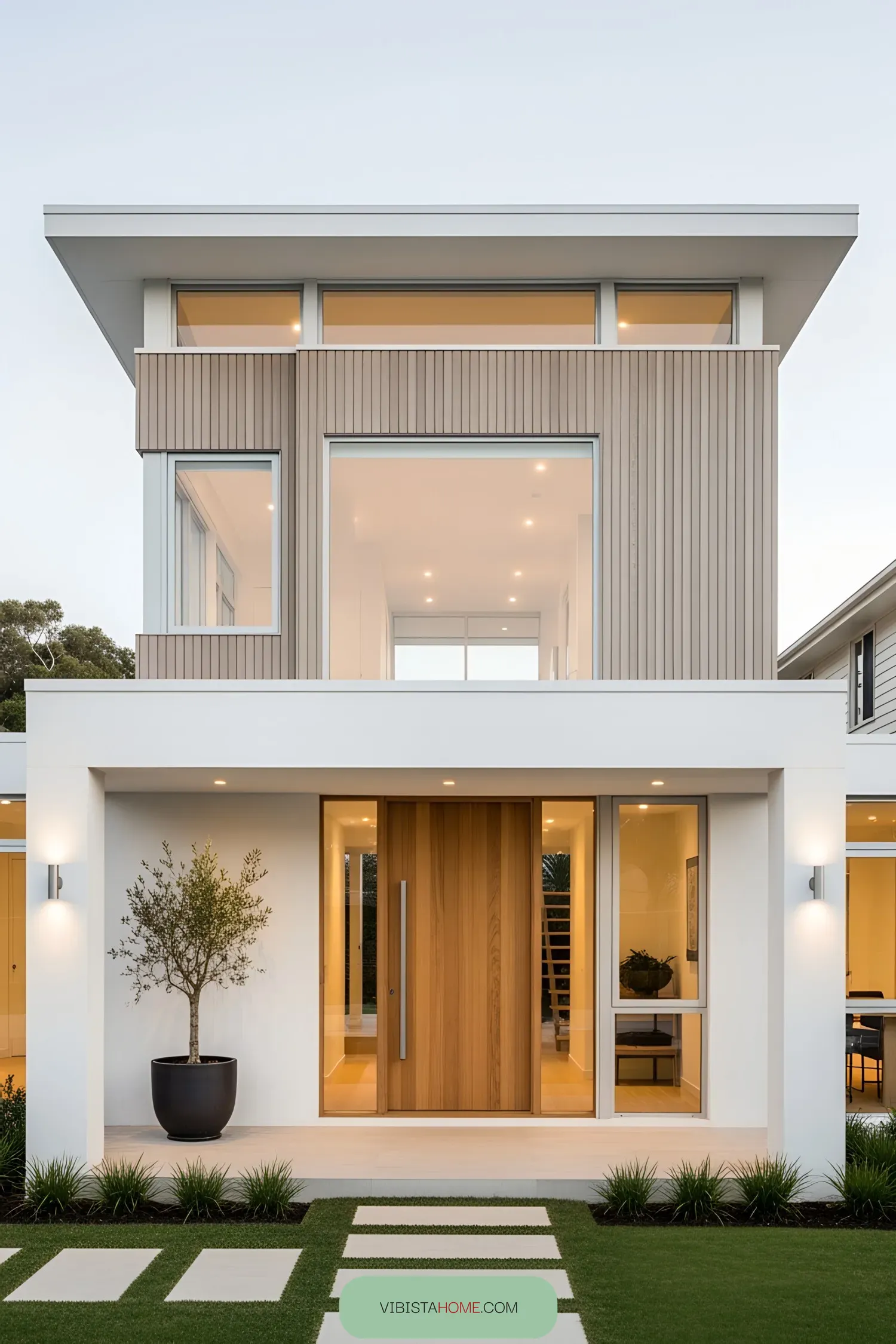 Contemporary coastal home with sleek facade and warm lighting