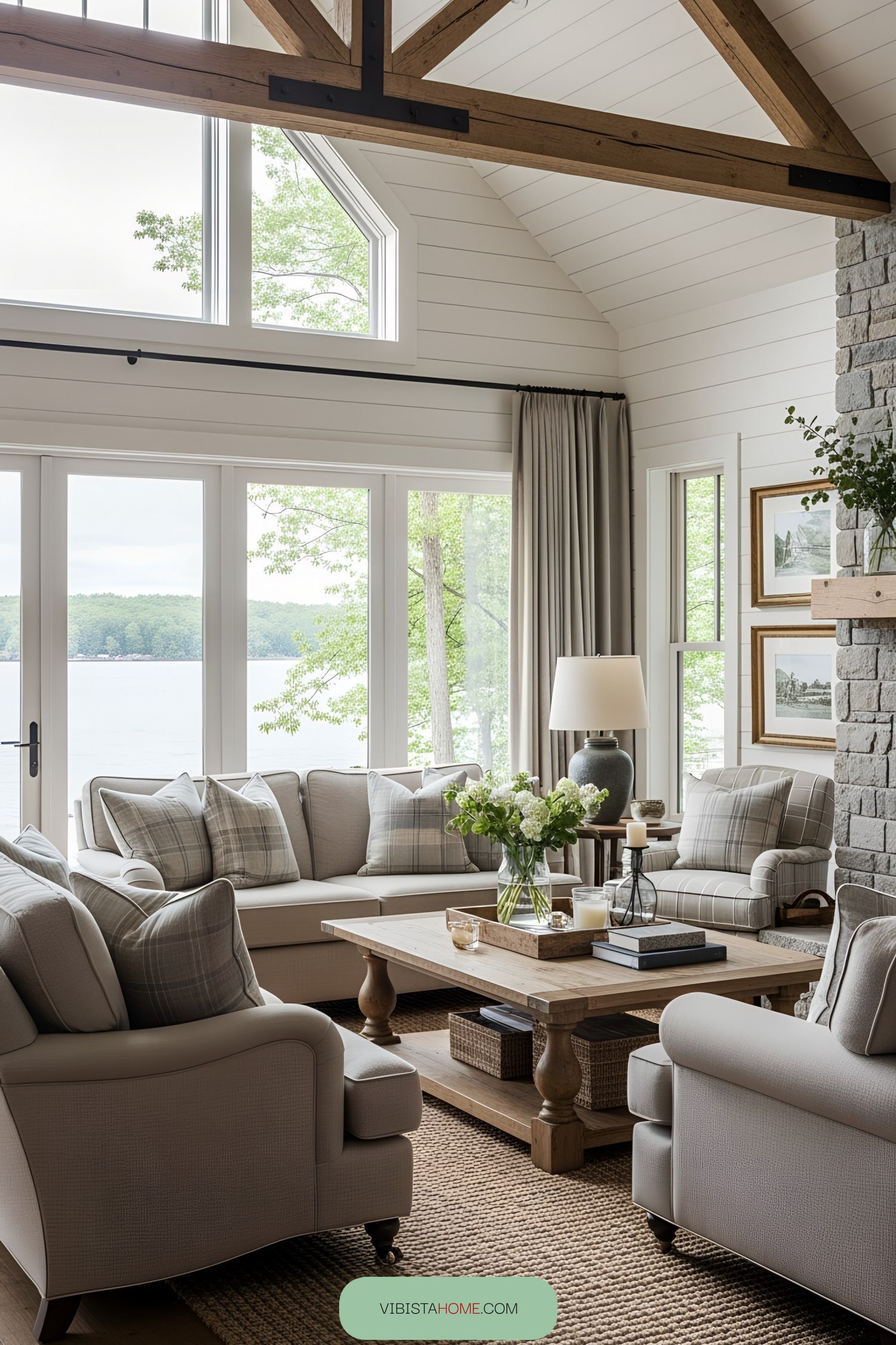 Lake house interior with large windows and cozy seating area