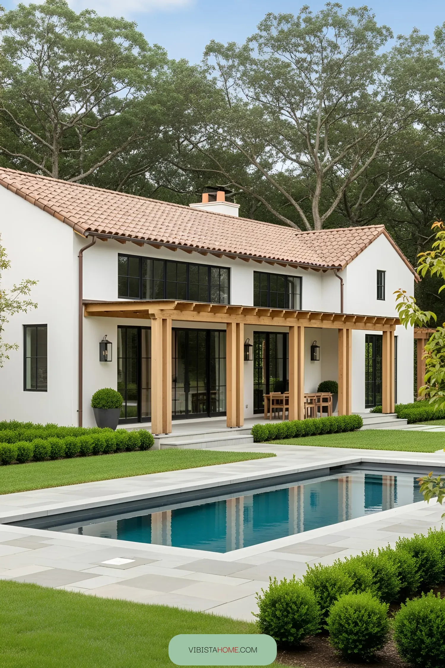 Contemporary farmhouse with wooden beams and a sleek pool