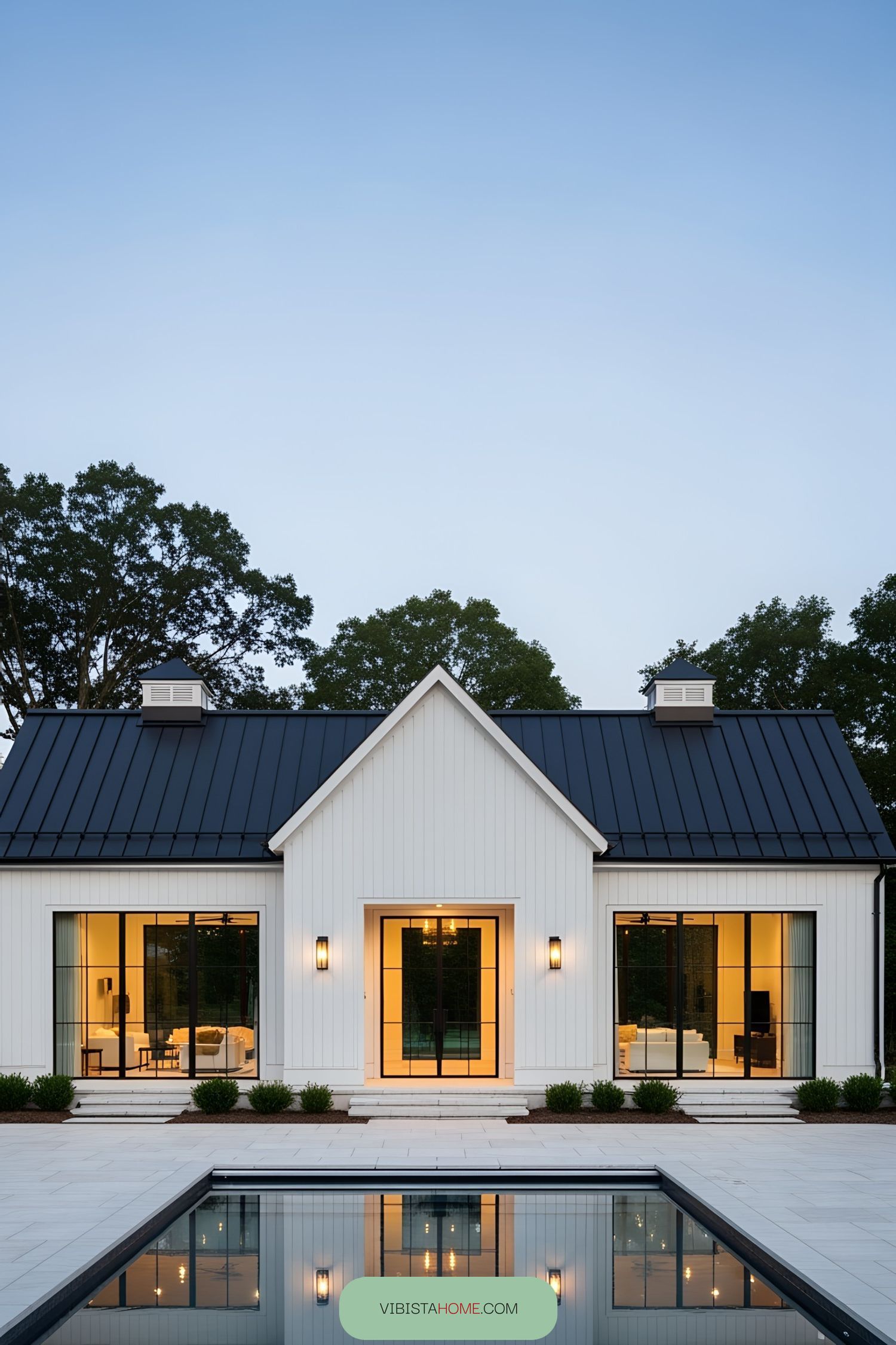 Modern barnhouse with a reflective pool