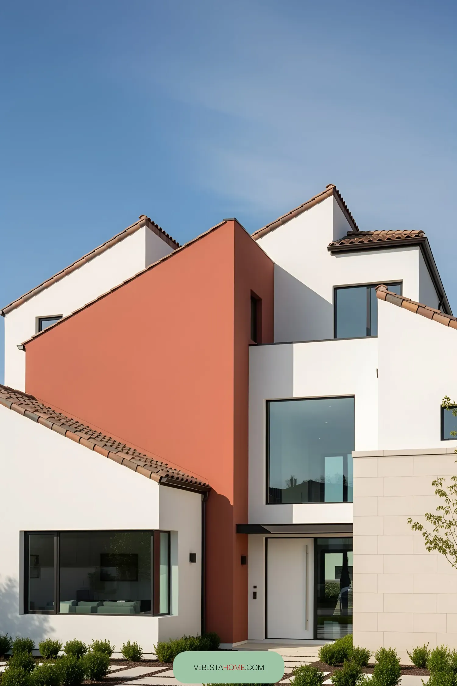 A modern villa with terracotta and white exteriors
