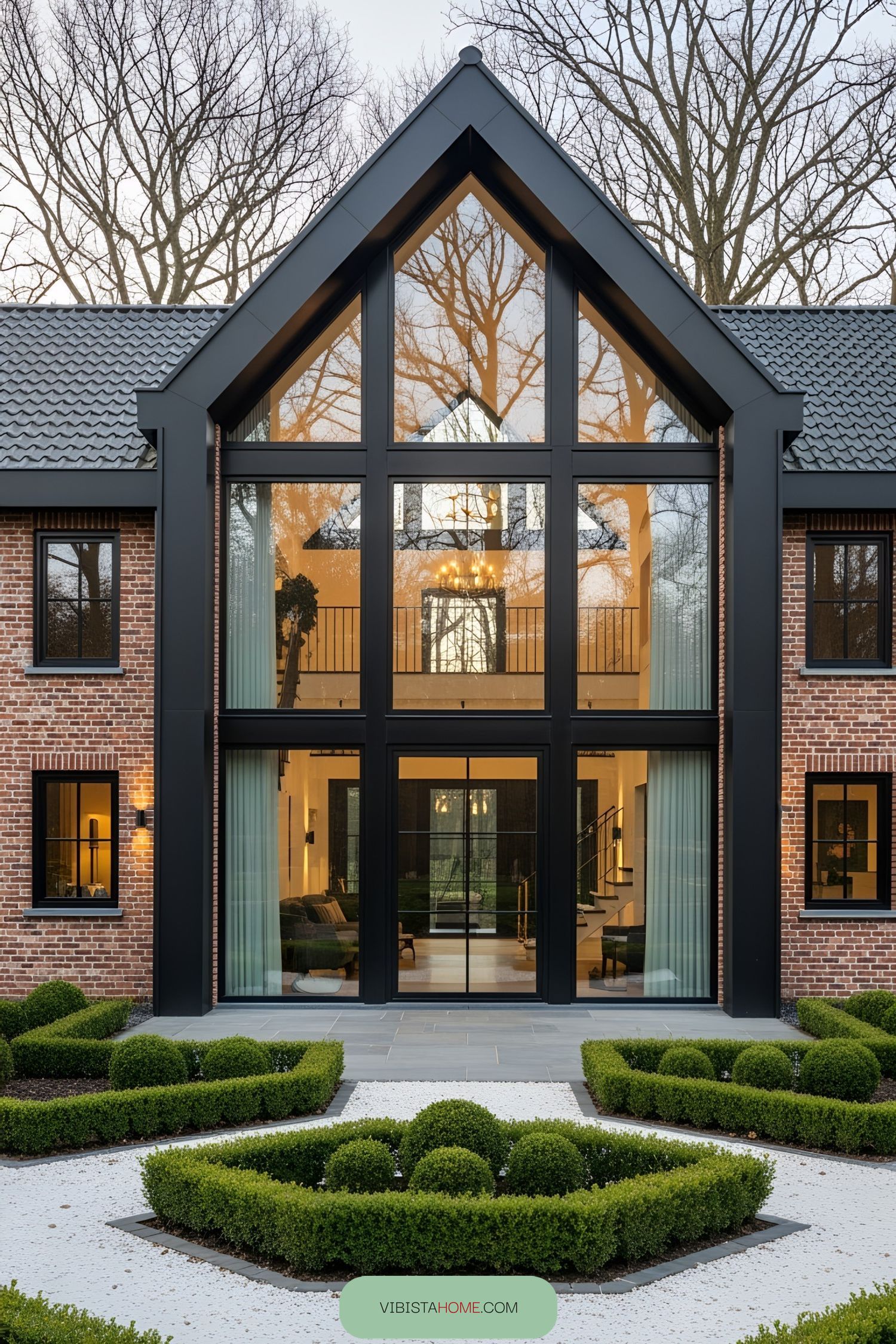 Modern house with large glass facade and brick exterior
