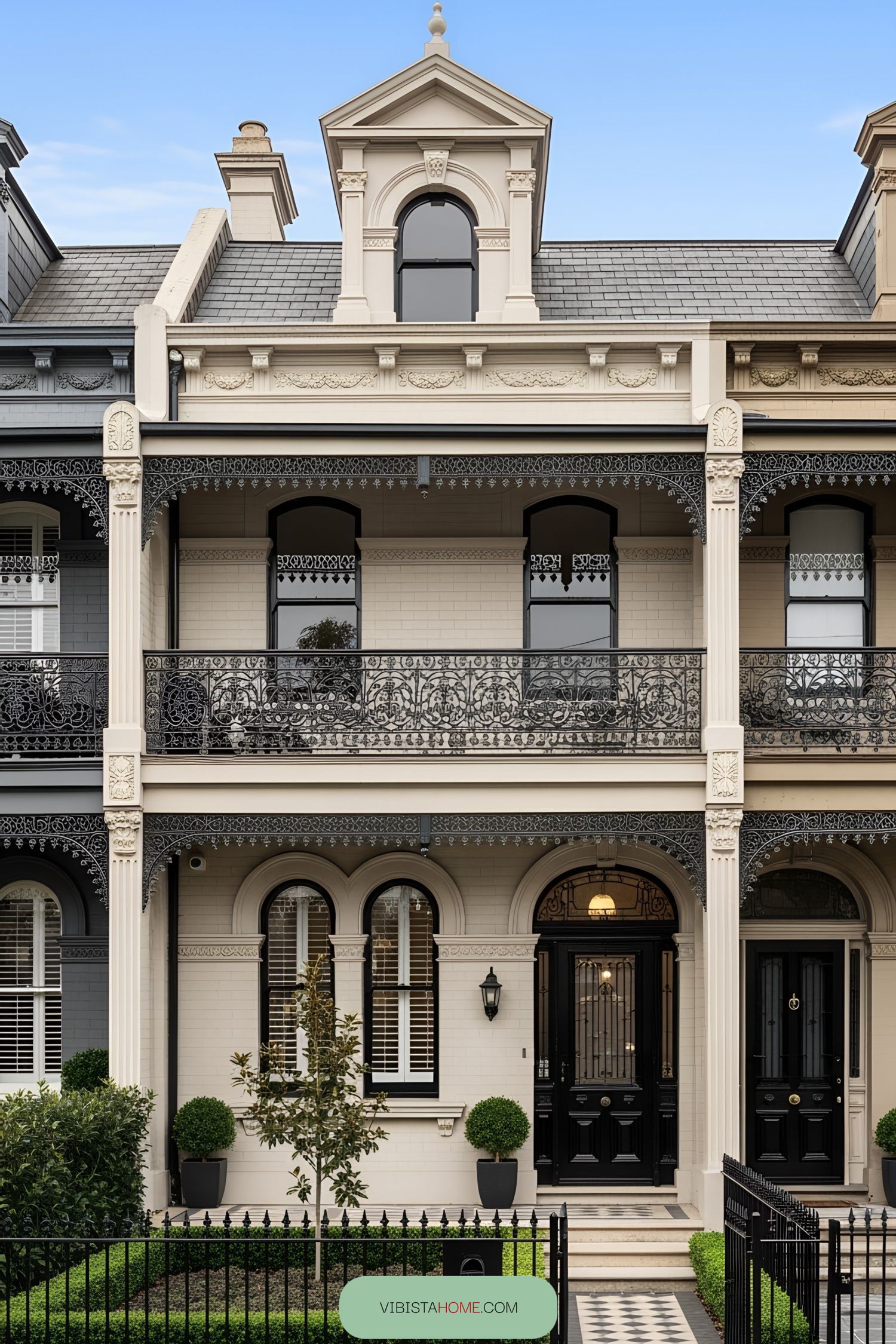 Ornate Victorian terrace facade with detailed ironwork
