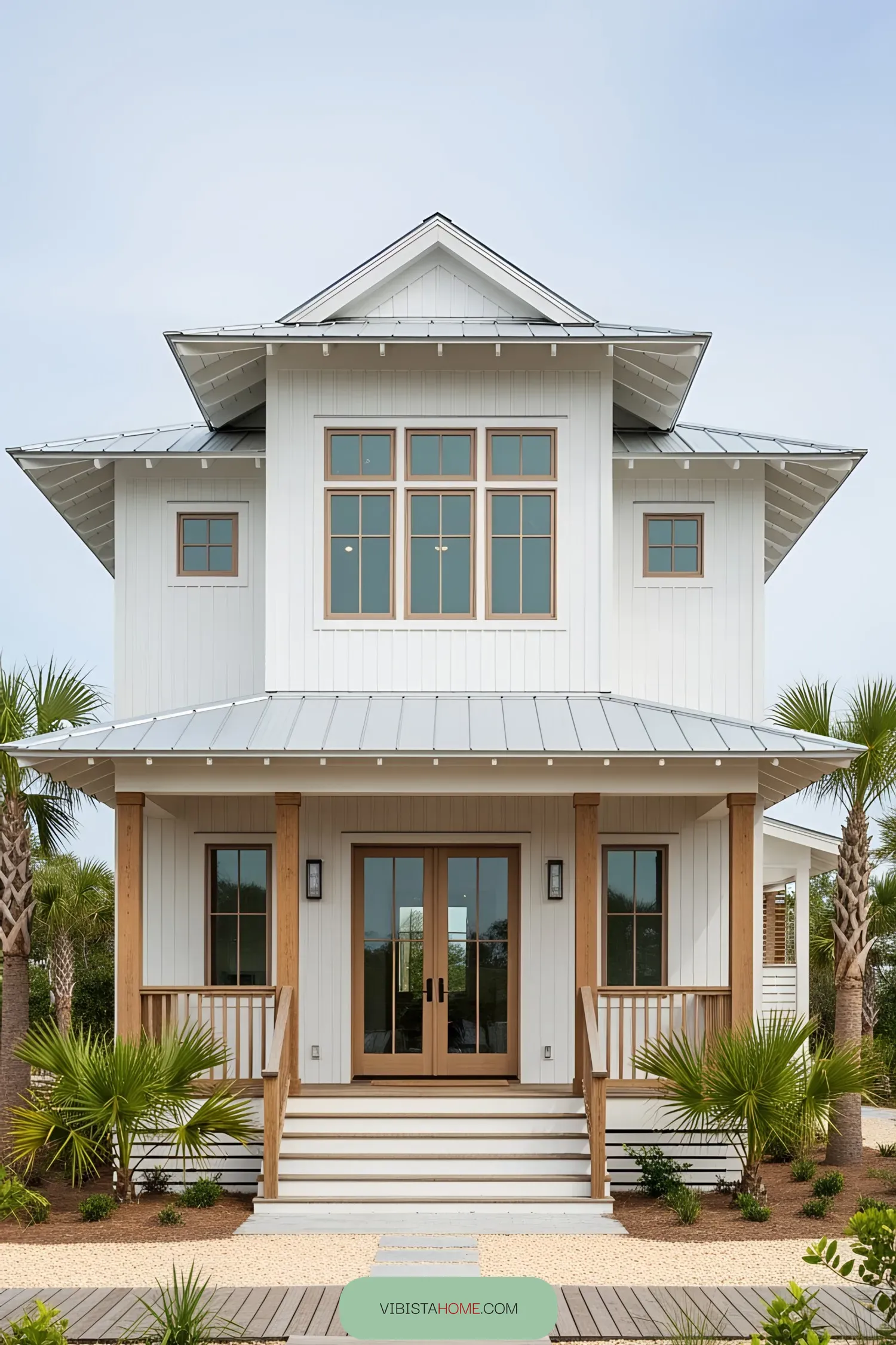Two-story white coastal house with a front porch