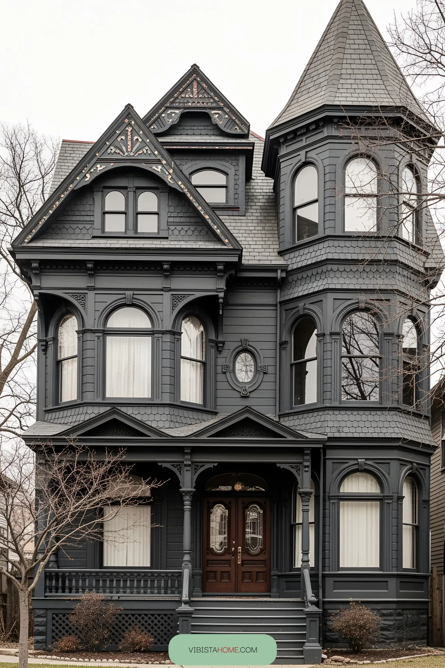 Elegant black Victorian house with a turret