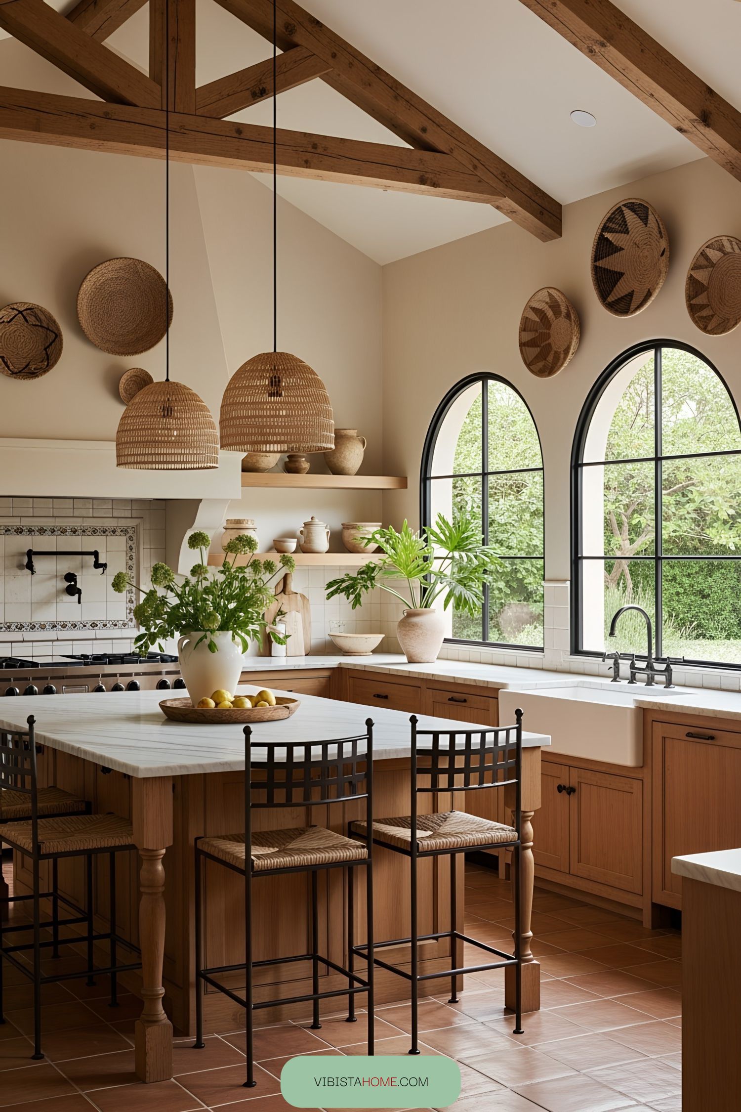 Rustic kitchen with arched windows and wooden beams