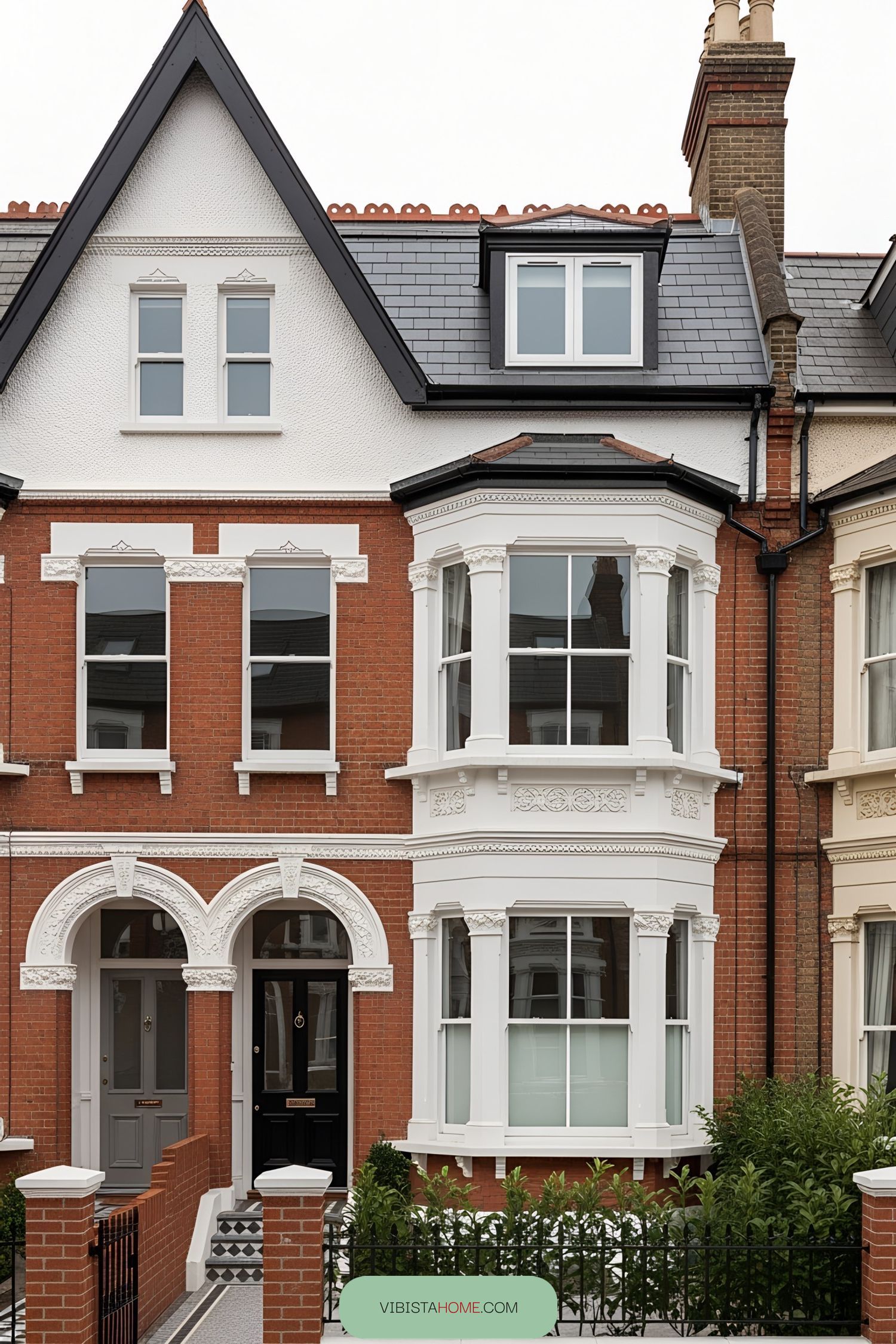 Victorian terrace house with arched doorways and bay windows