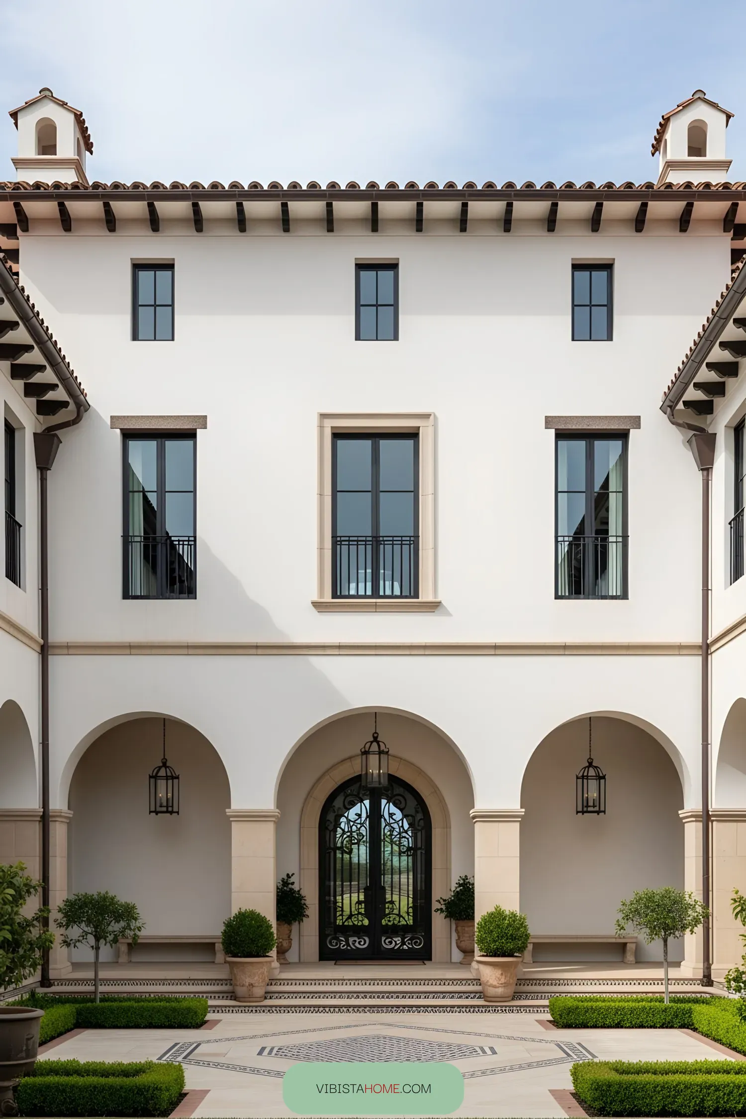 Elegant Spanish farmhouse courtyard with arched entryway
