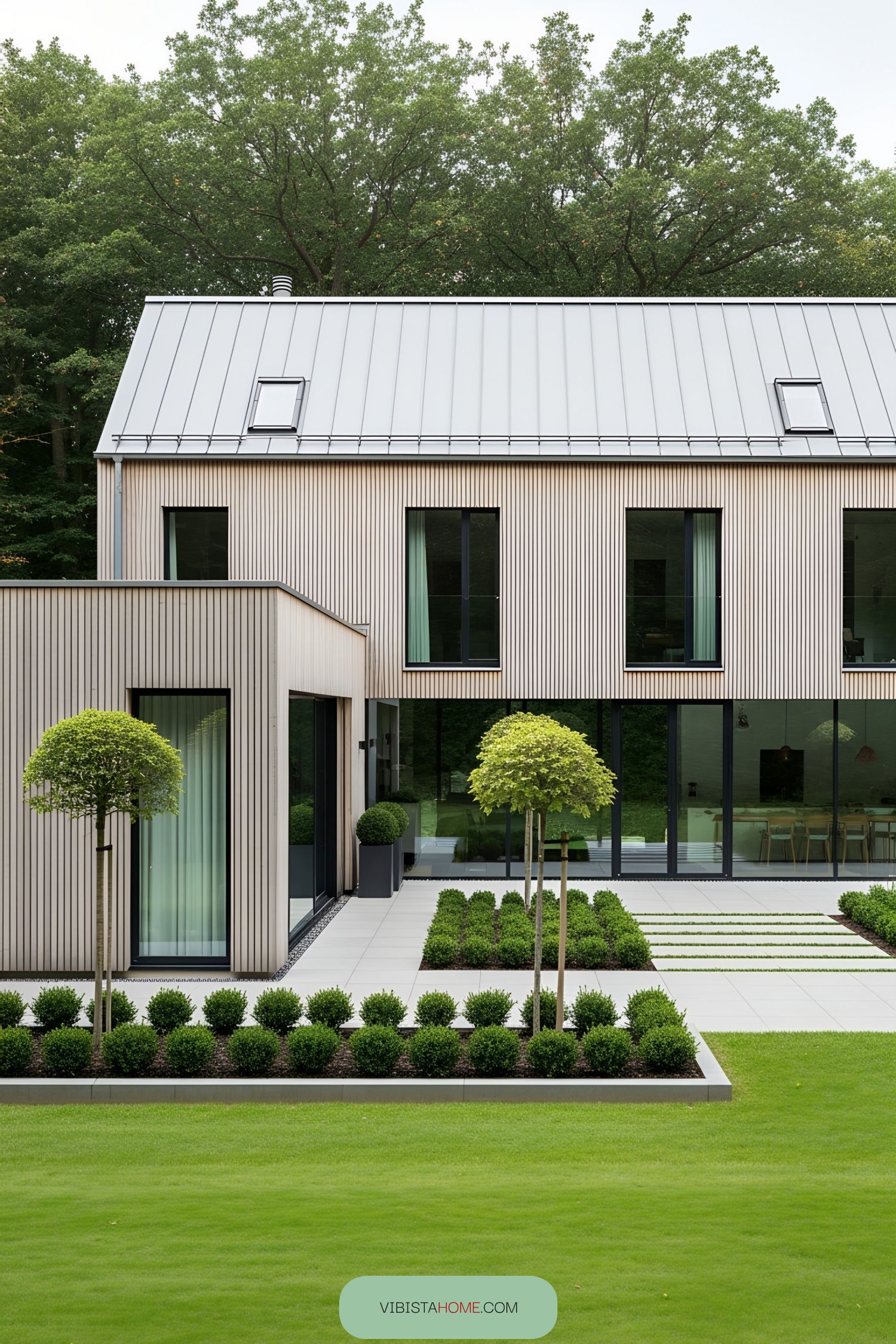 Contemporary farmhouse with sleek design elements and lush garden