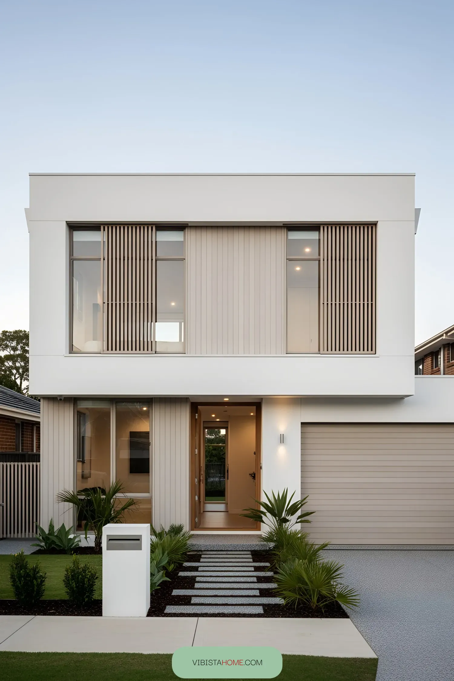 Modern two-story coastal house facade with clean lines