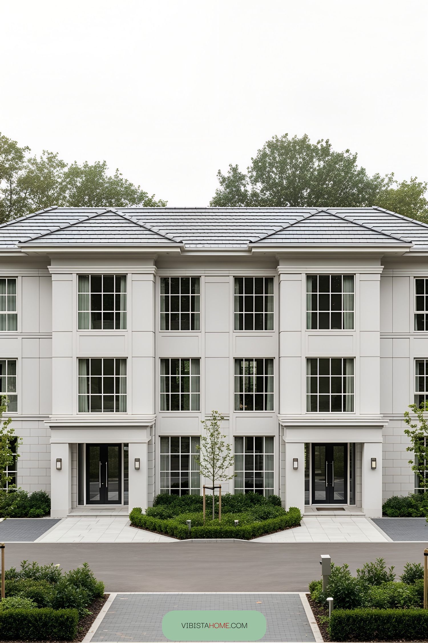 Elegant duplex with large windows and manicured garden
