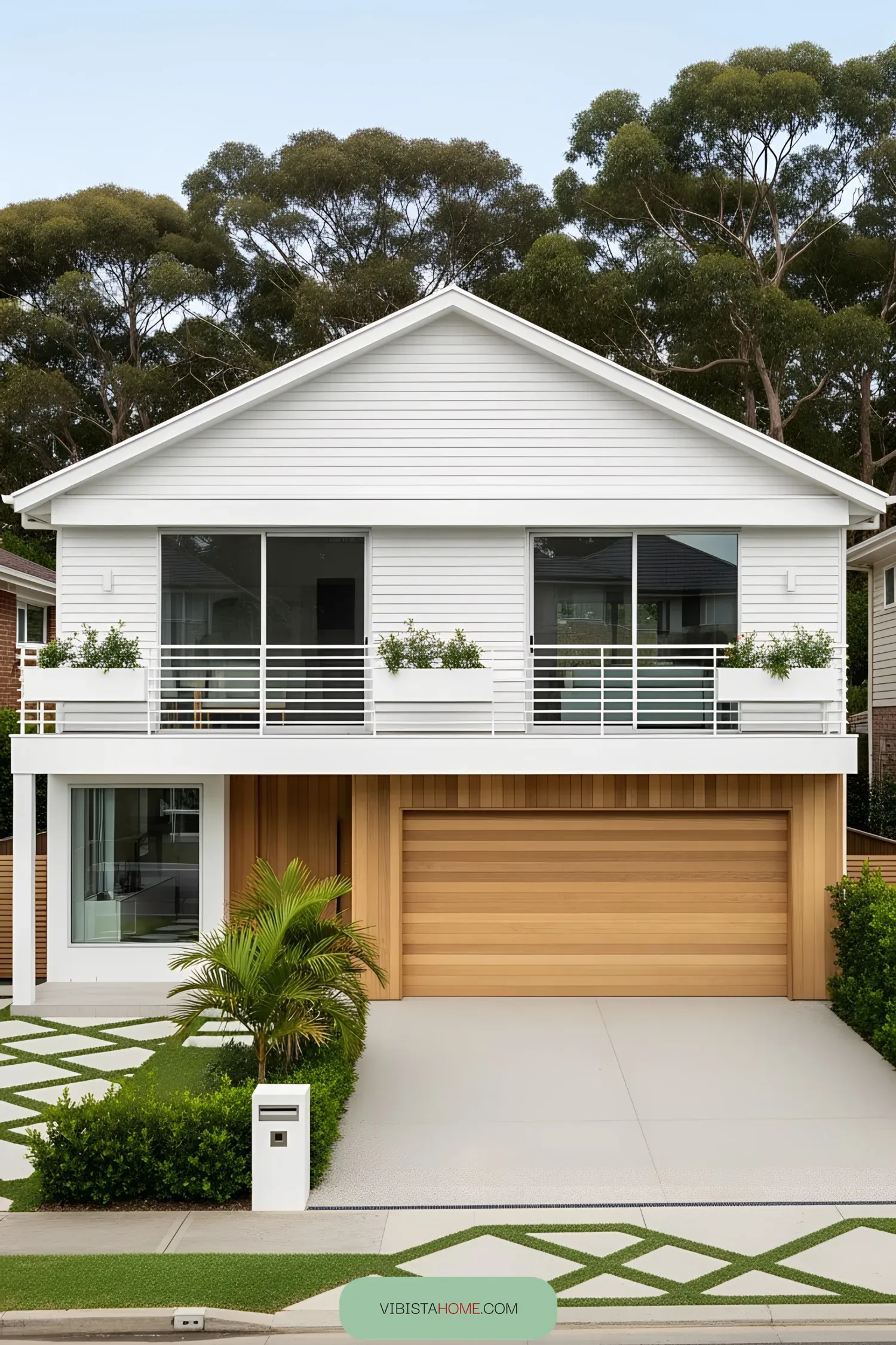 Modern beach house with white facade and wooden accents