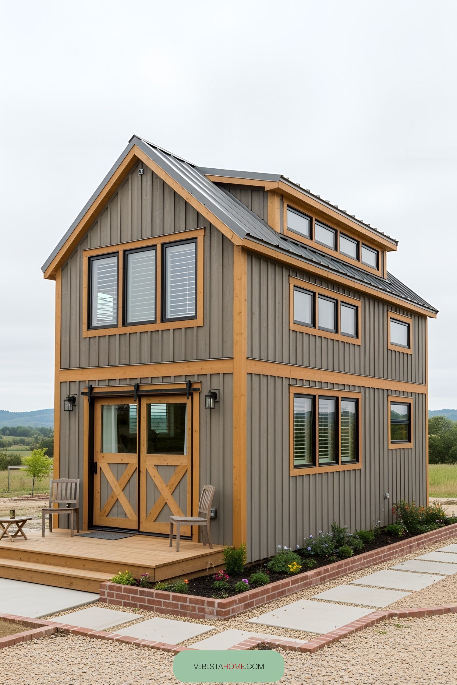 Compact barndominium with a modern design in a field