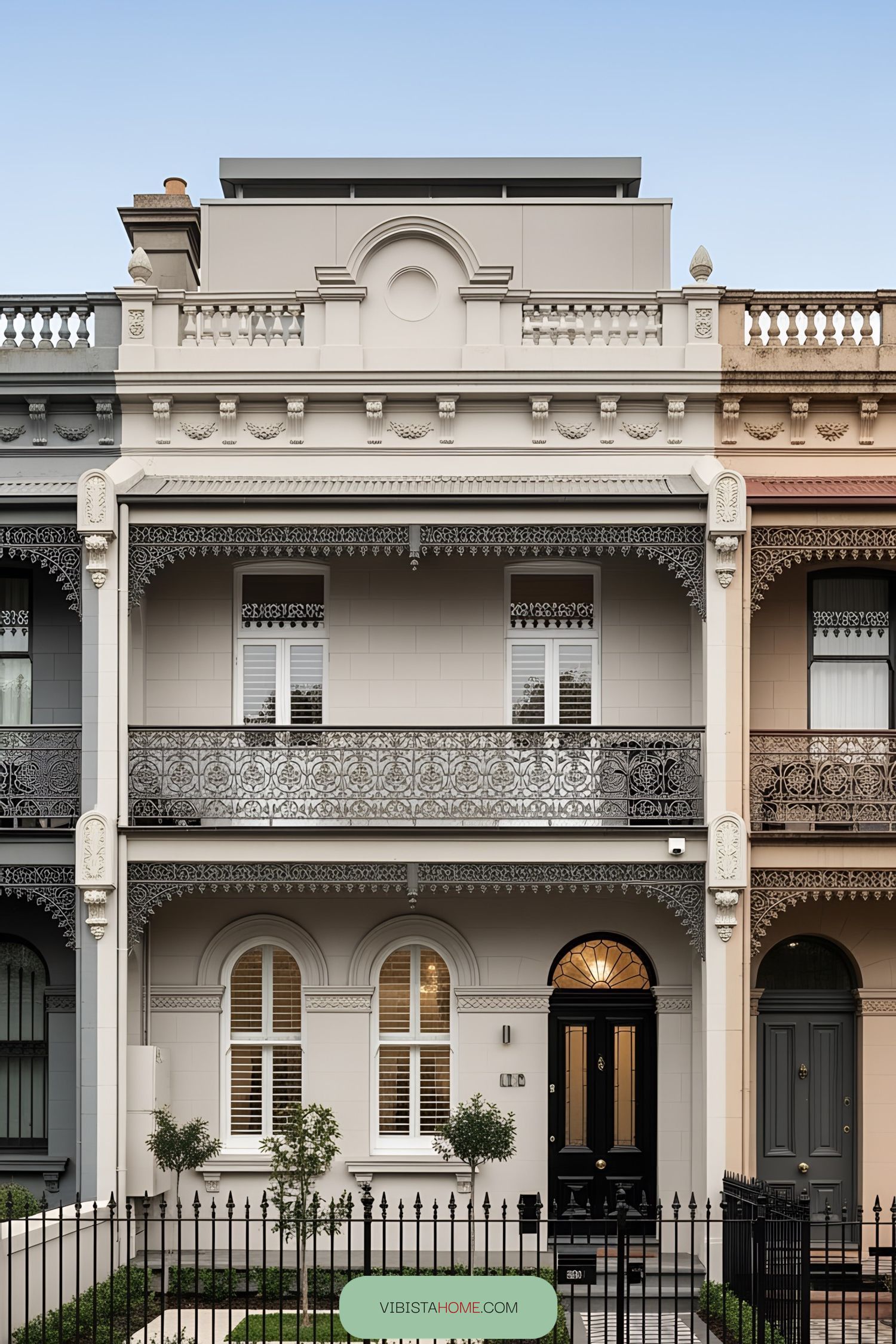 Victorian terrace house with ornate balconies and classic design
