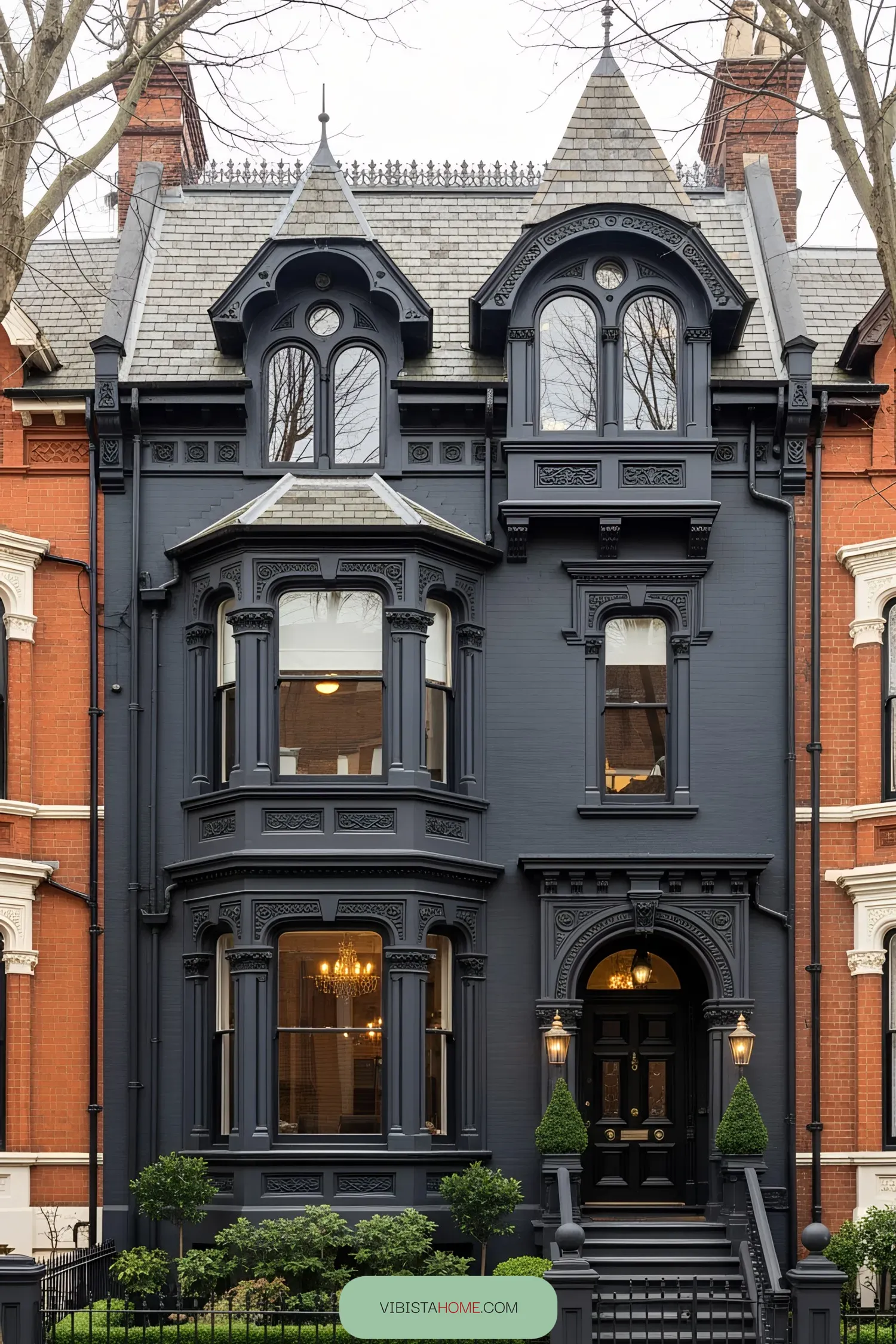 Black Victorian house with ornate detailing and large bay windows