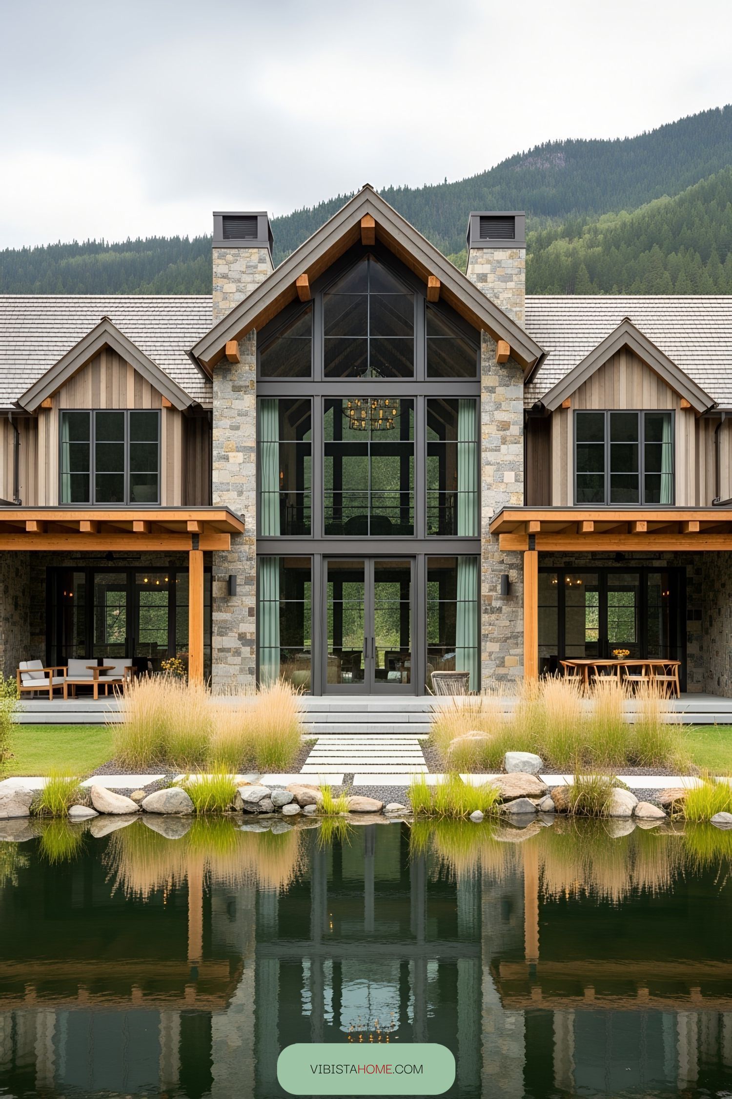 Modern rustic house by a serene pond with mountain views