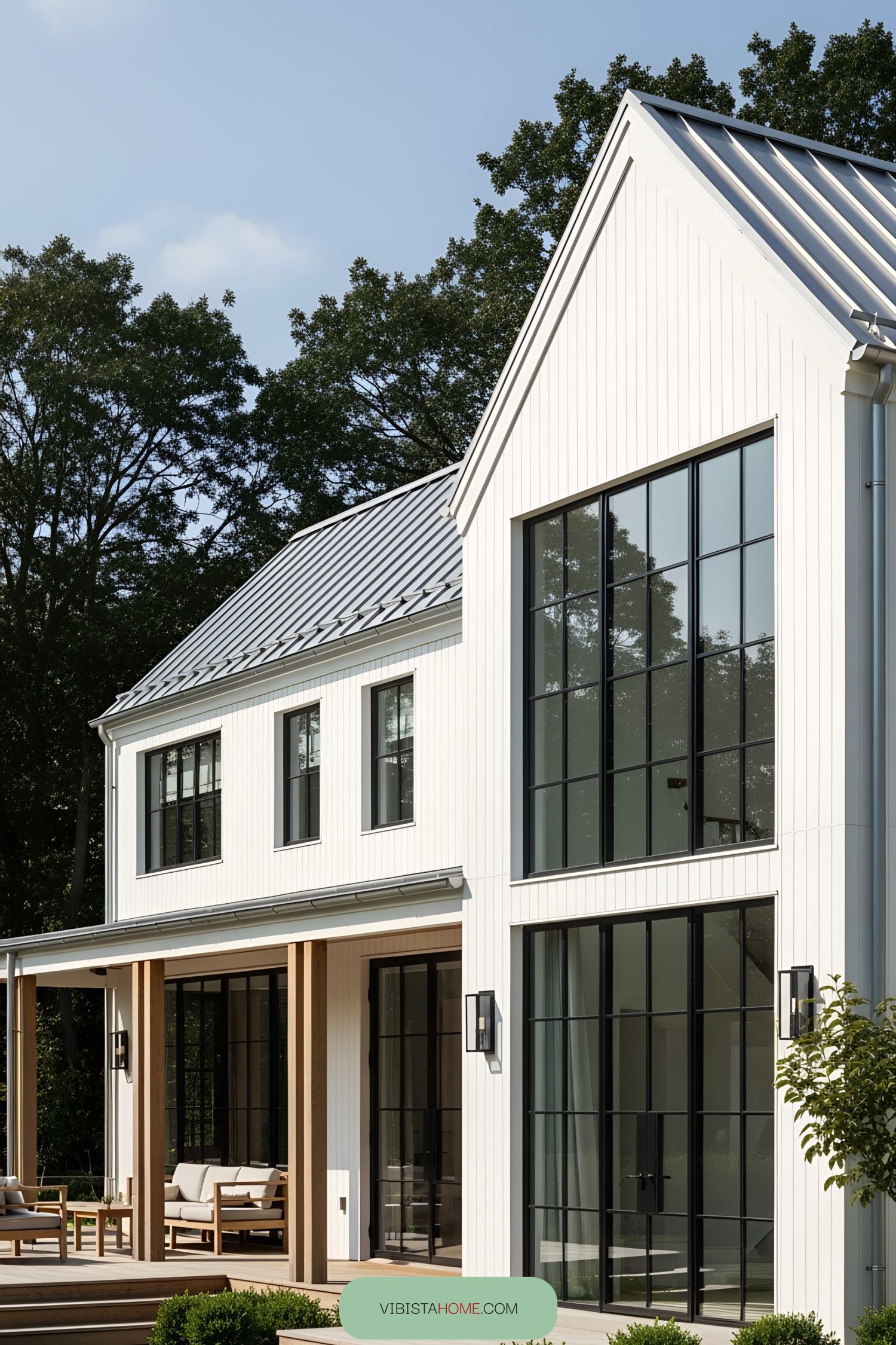 White farmhouse with black-framed windows and modern design