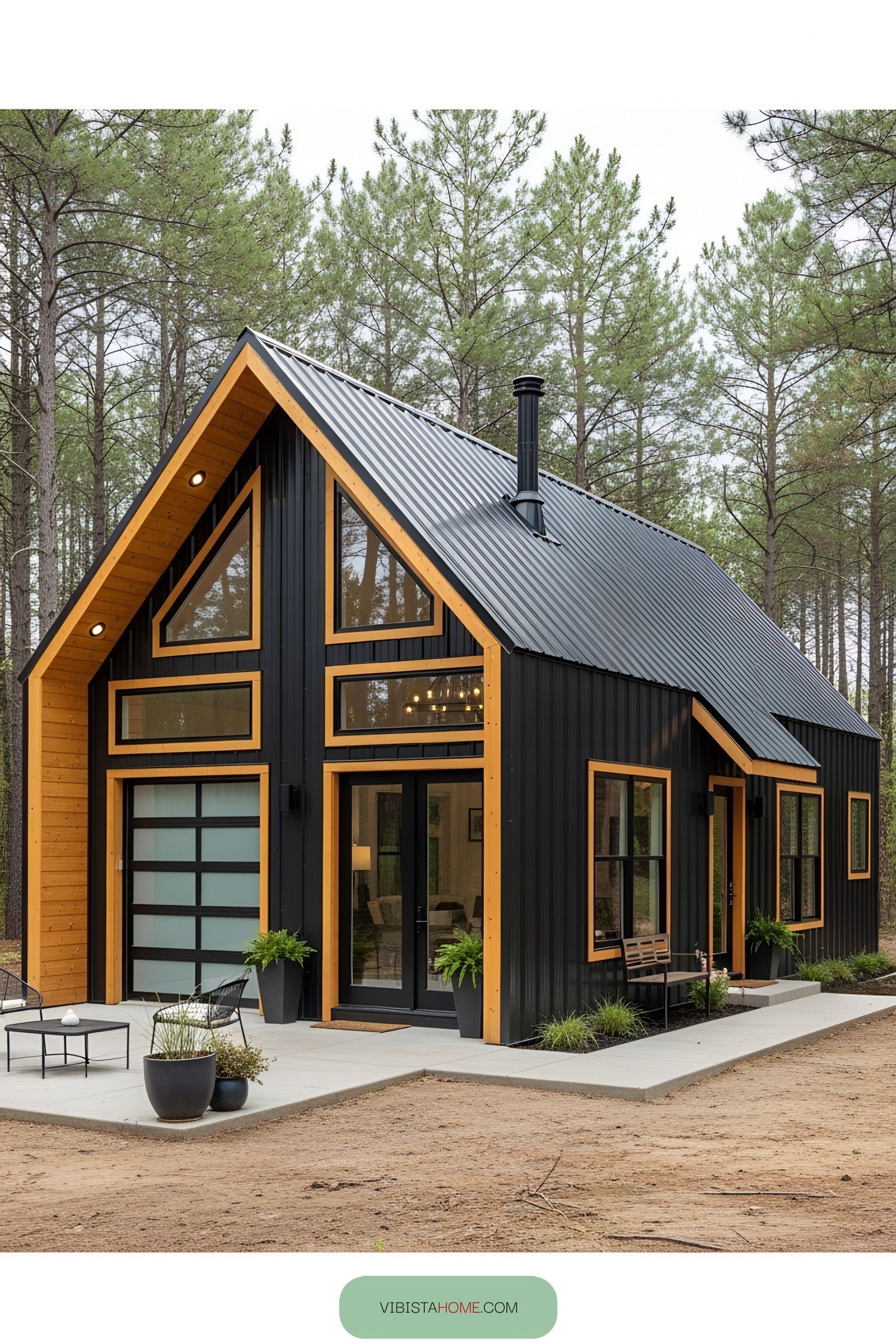Compact, stylish barndominium with a black exterior and wood accents
