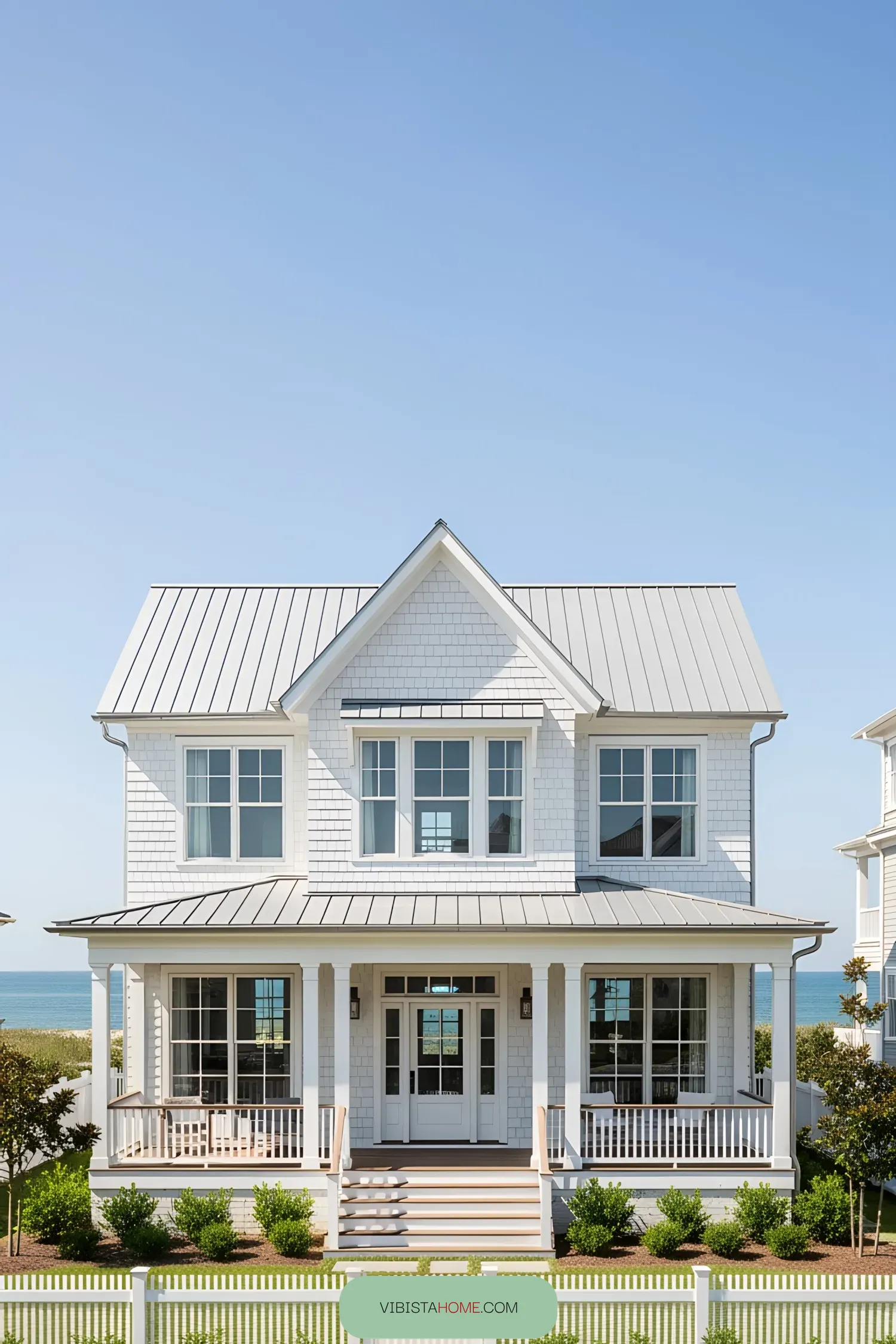 Charming white coastal house with a porch