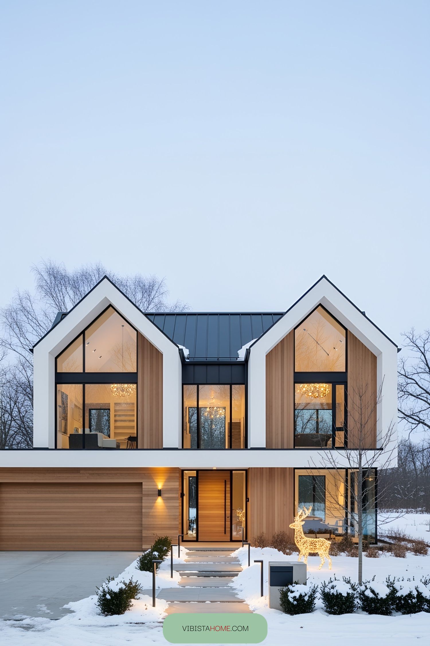 Modern Scandinavian house with large glass windows and a snowy yard