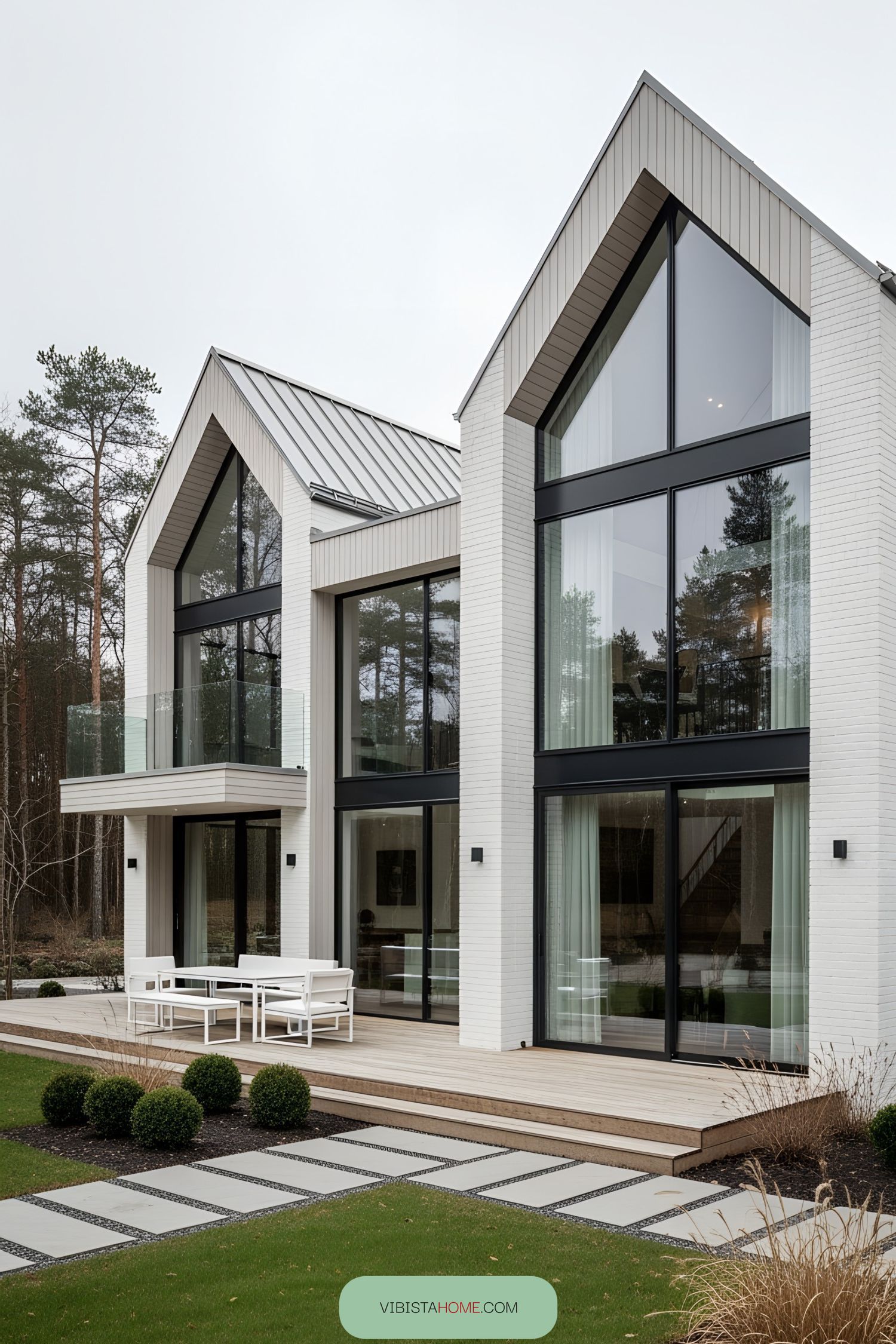 Modern Scandinavian home with glass facade and gabled roof