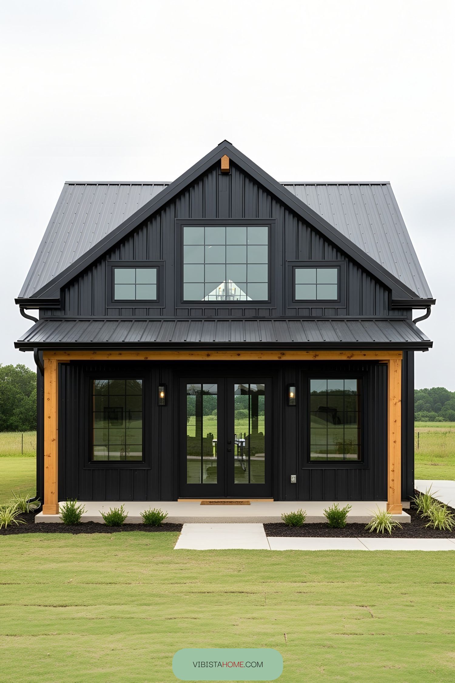 Compact black barndominium with a sleek design
