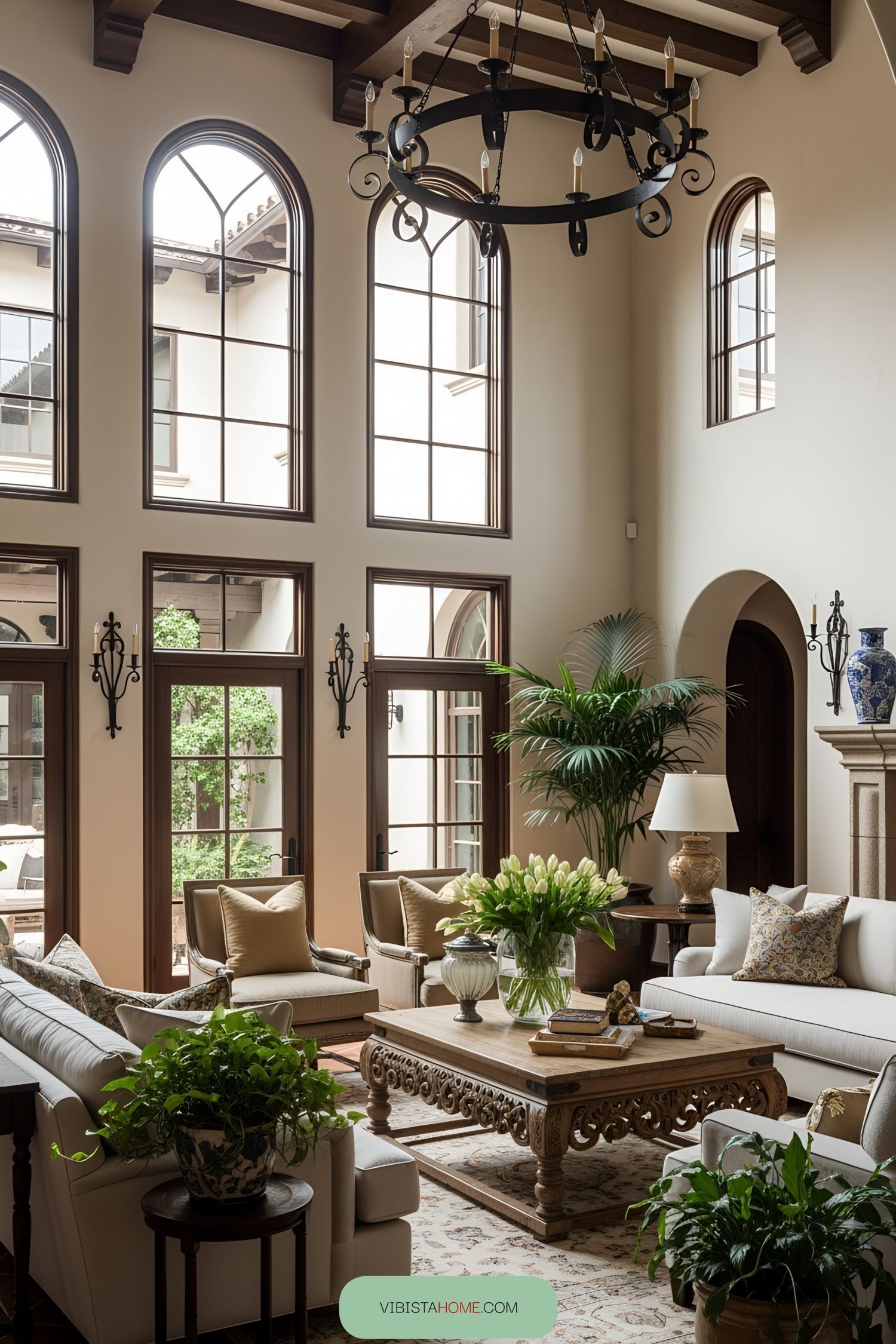 Elegant living room with high ceilings and large arched windows