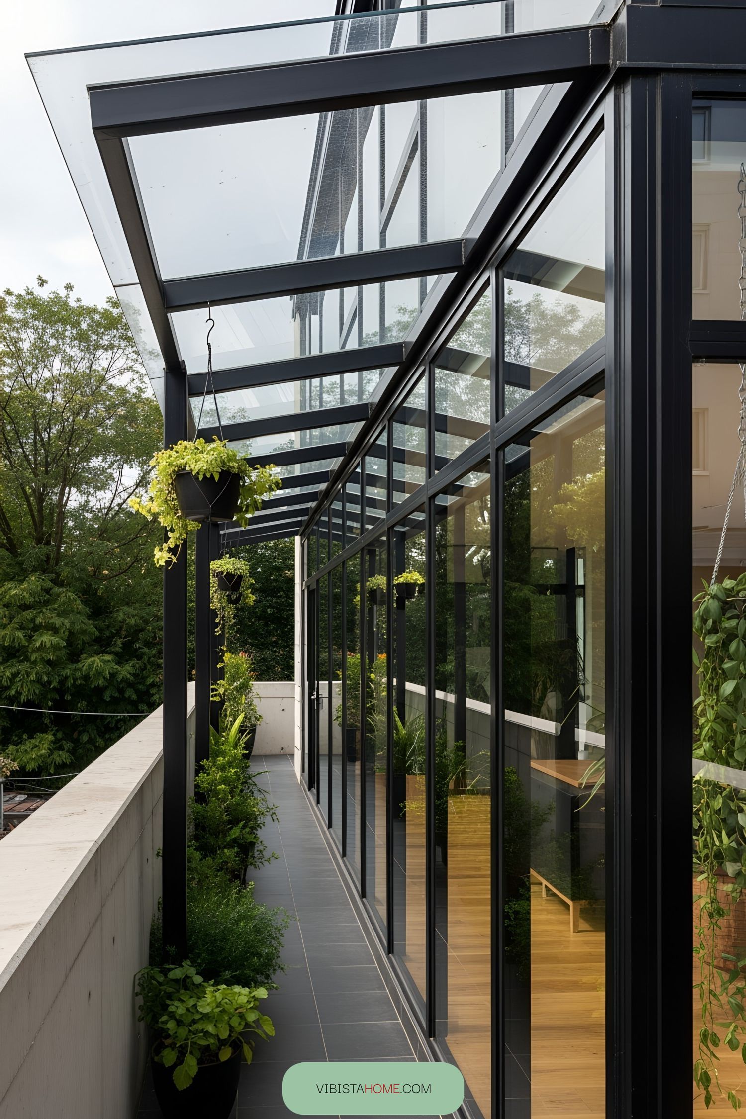 Glass terrace with metal frames and hanging planters