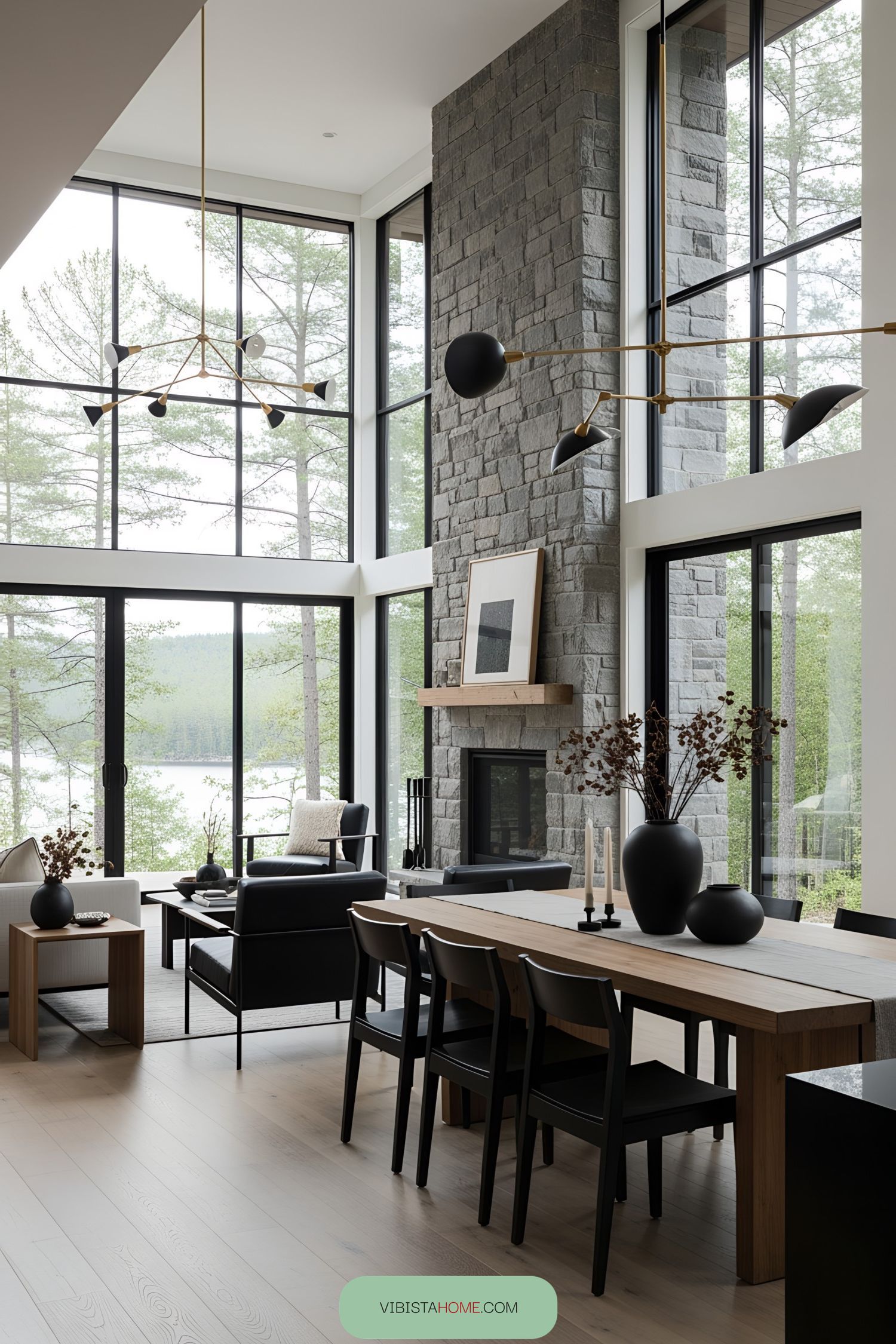 Contemporary living room with large stone fireplace and tall windows