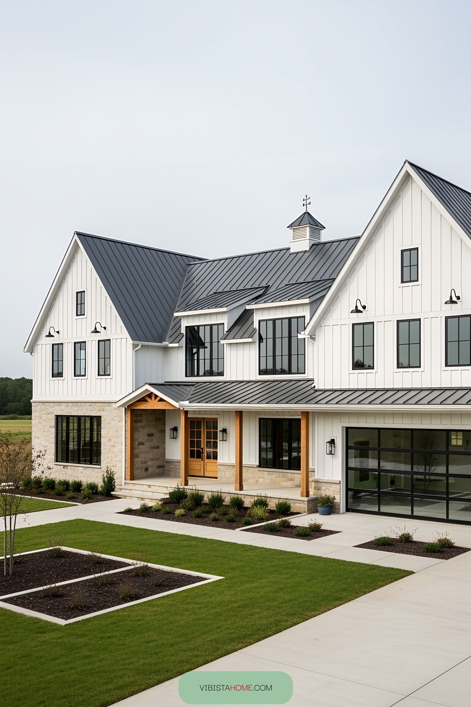 Sleek modern white barn house with manicured lawn
