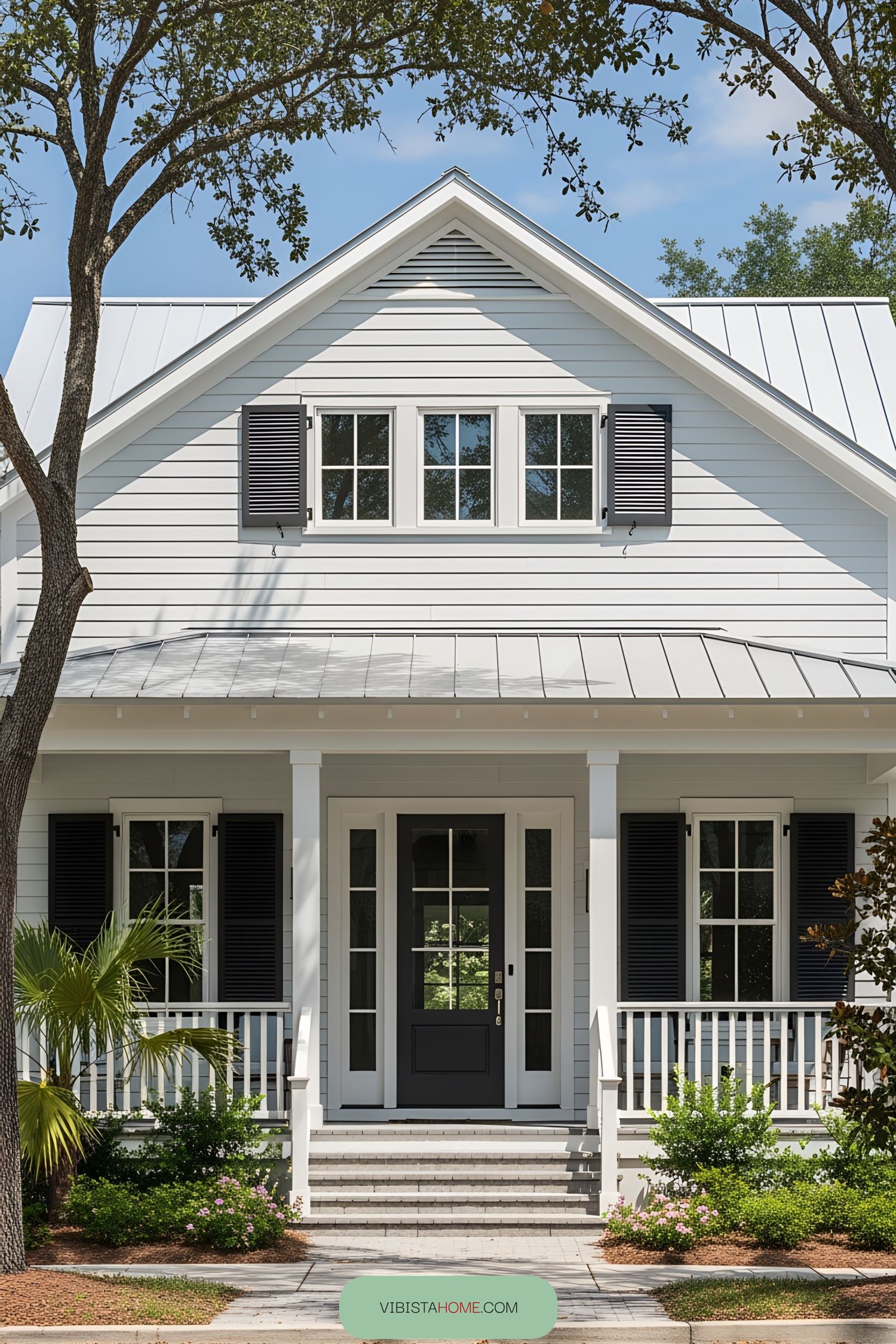 White coastal bungalow with black accents