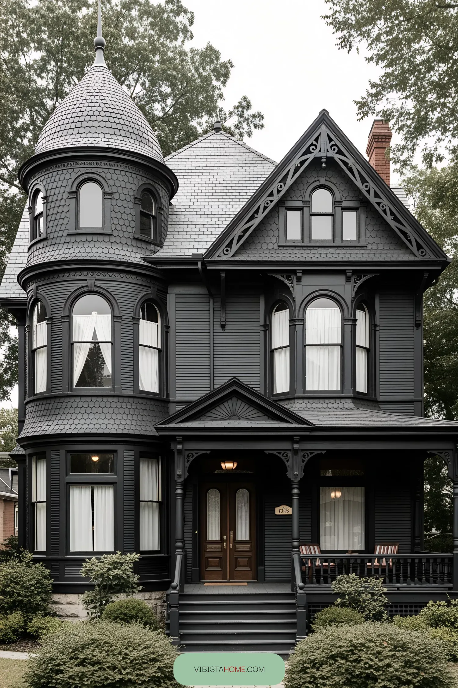 Elegant black Victorian house with turret