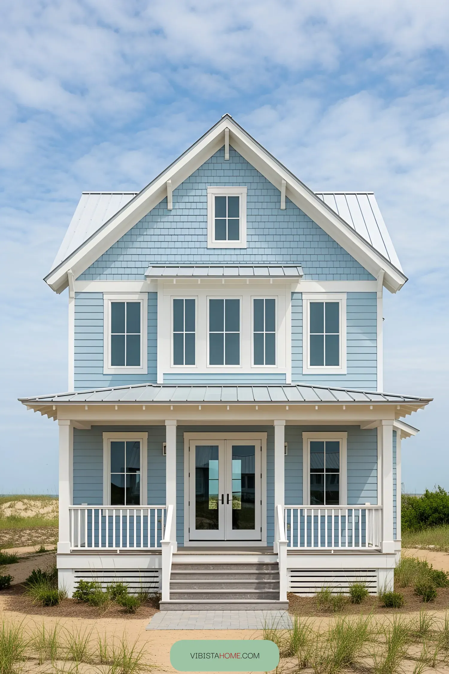 Charming blue coastal cottage with white trim