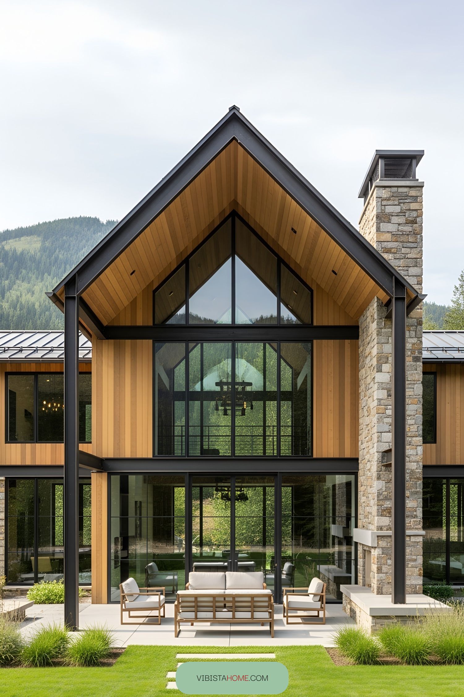 Modern cabin with large glass windows and stone elements