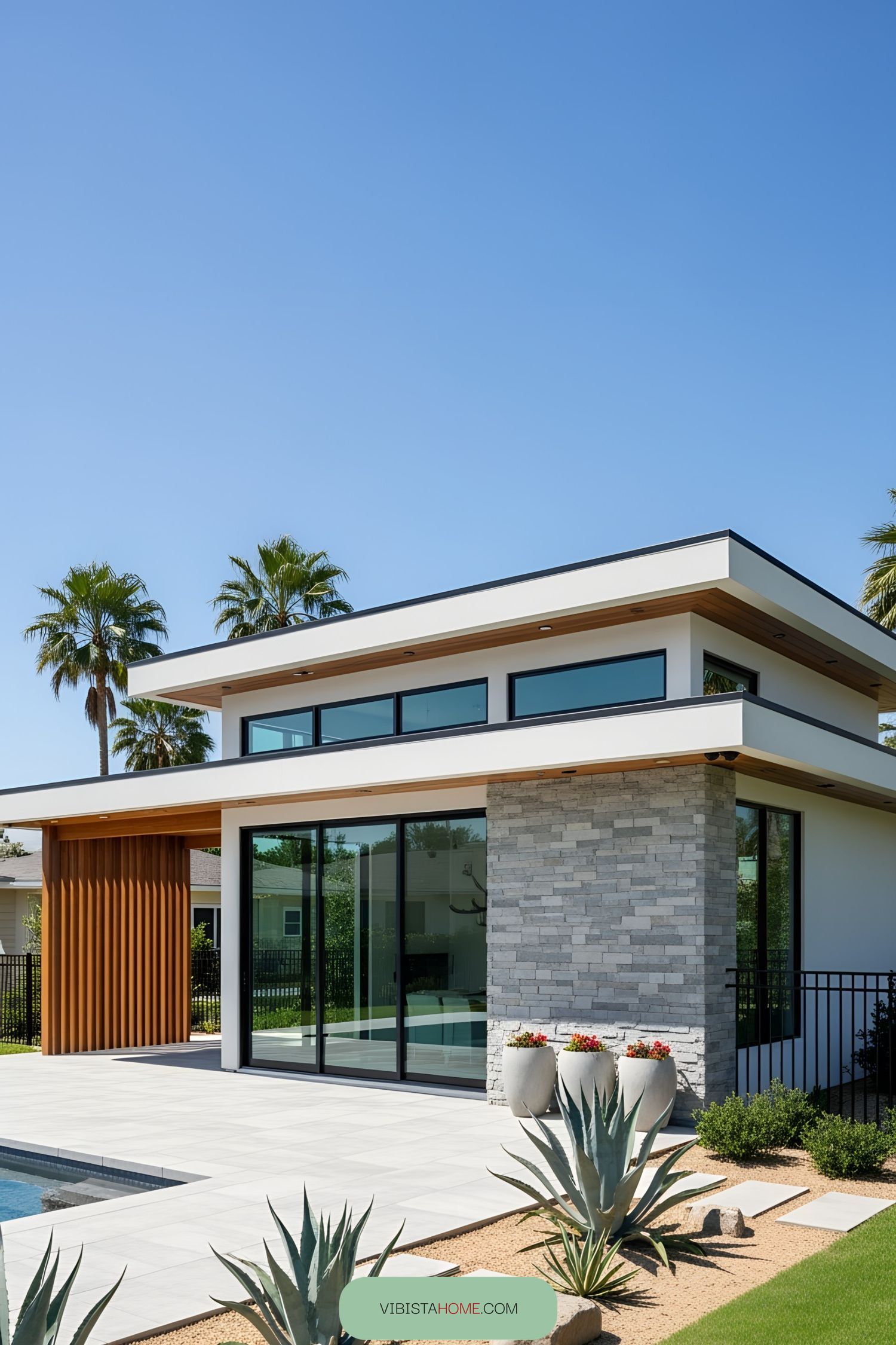 Modern pool house with sleek design and large windows