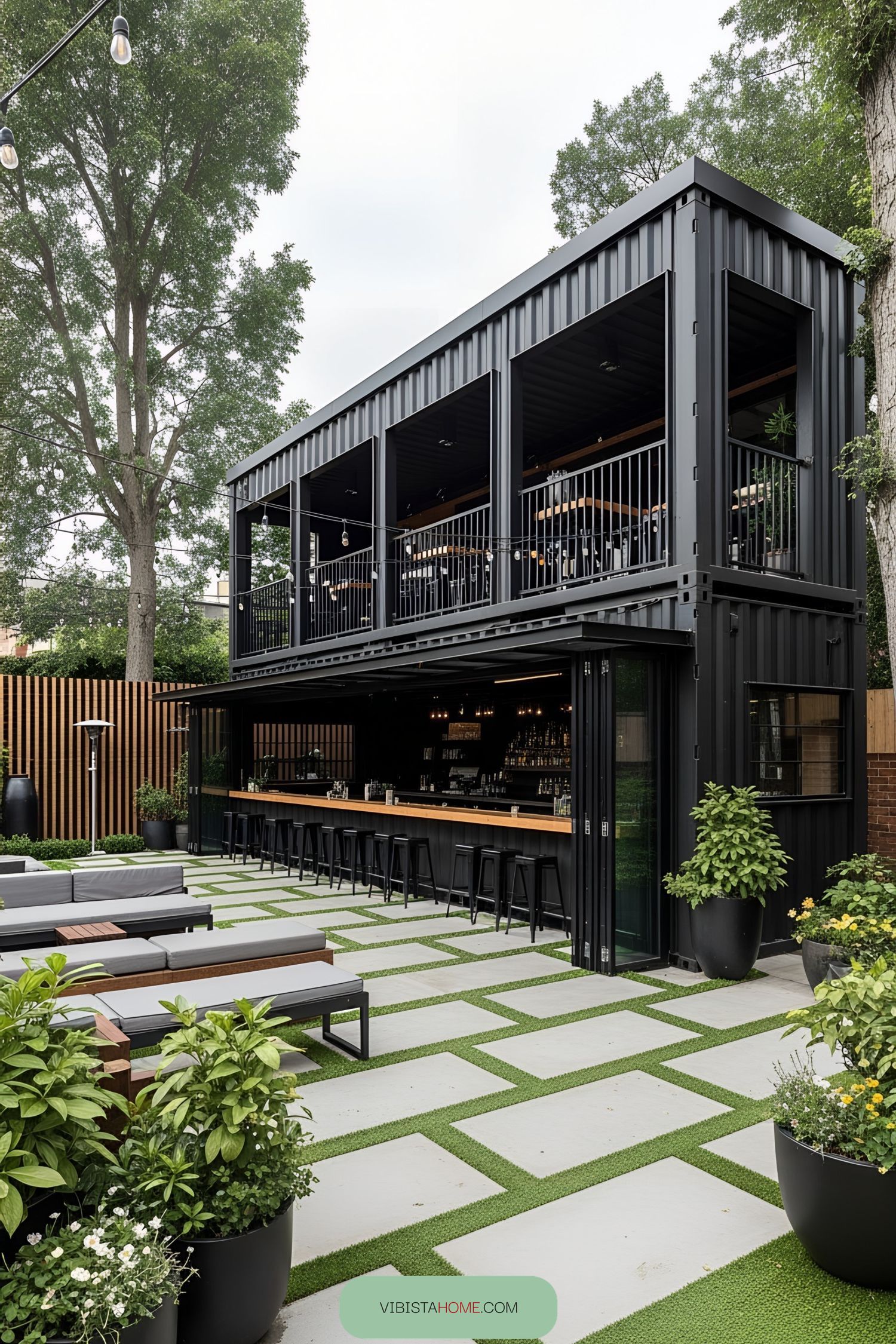 Sleek black container bar with patio seating