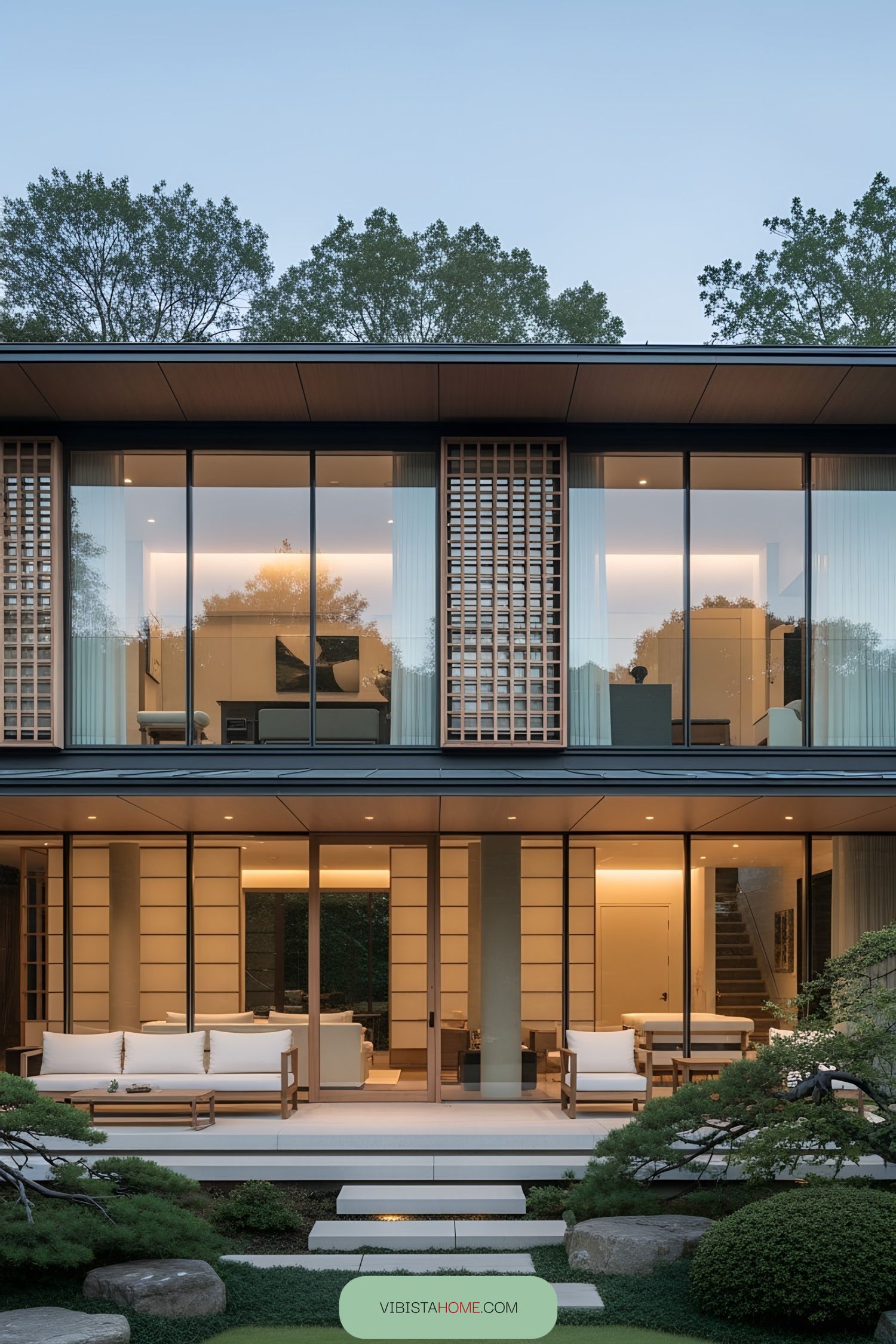 Modern Japanese home with large glass windows and a serene garden
