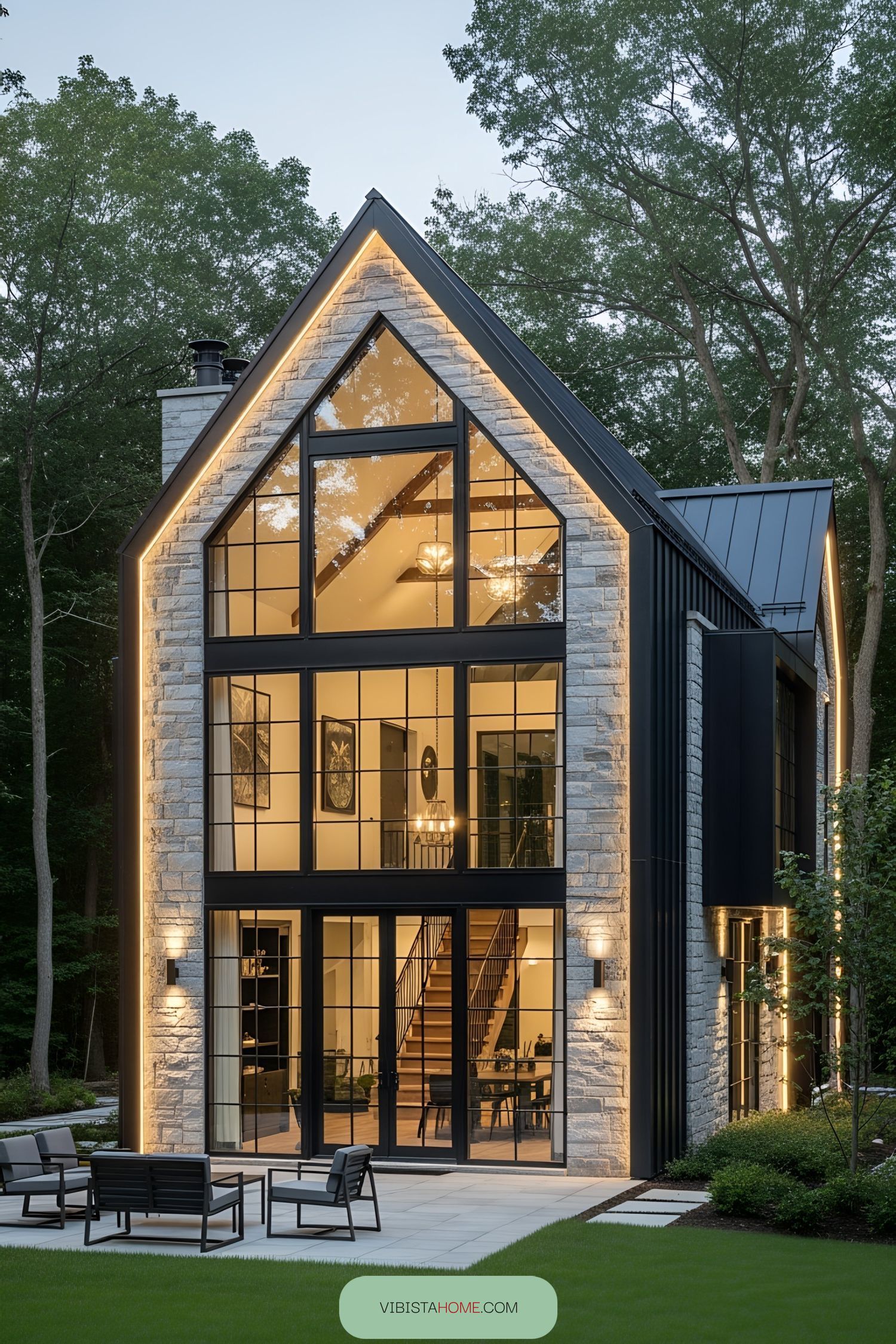 Modern rustic home with large windows and stone facade