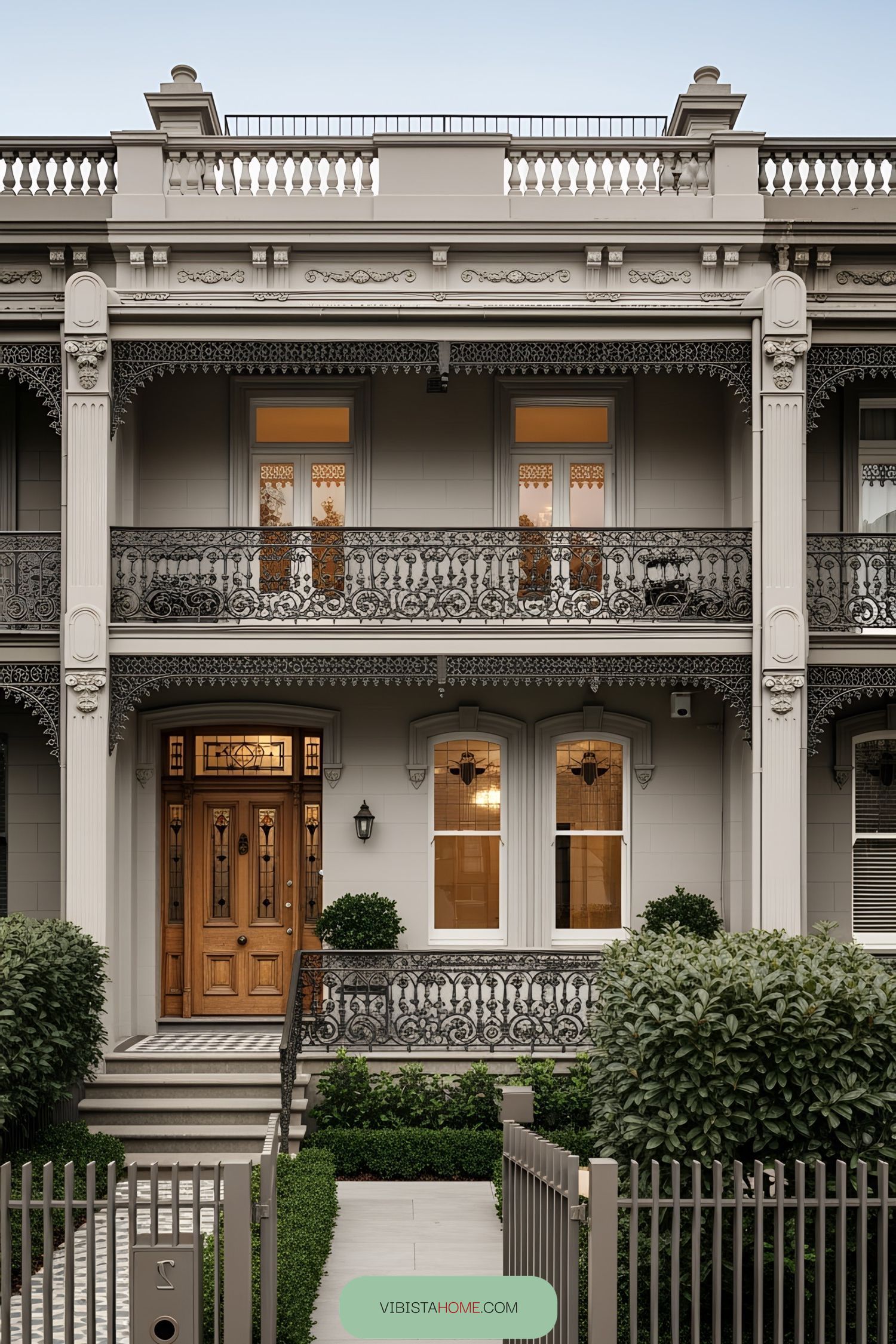Charming Victorian House With Decorative Ironwork and Wooden Door