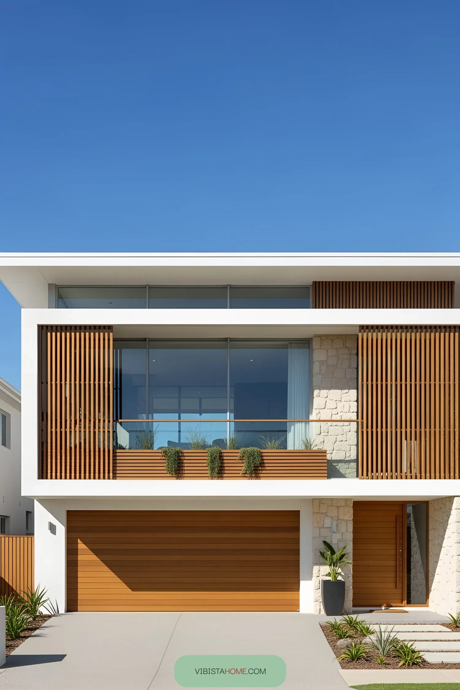Modern coastal house with wood accents and large windows