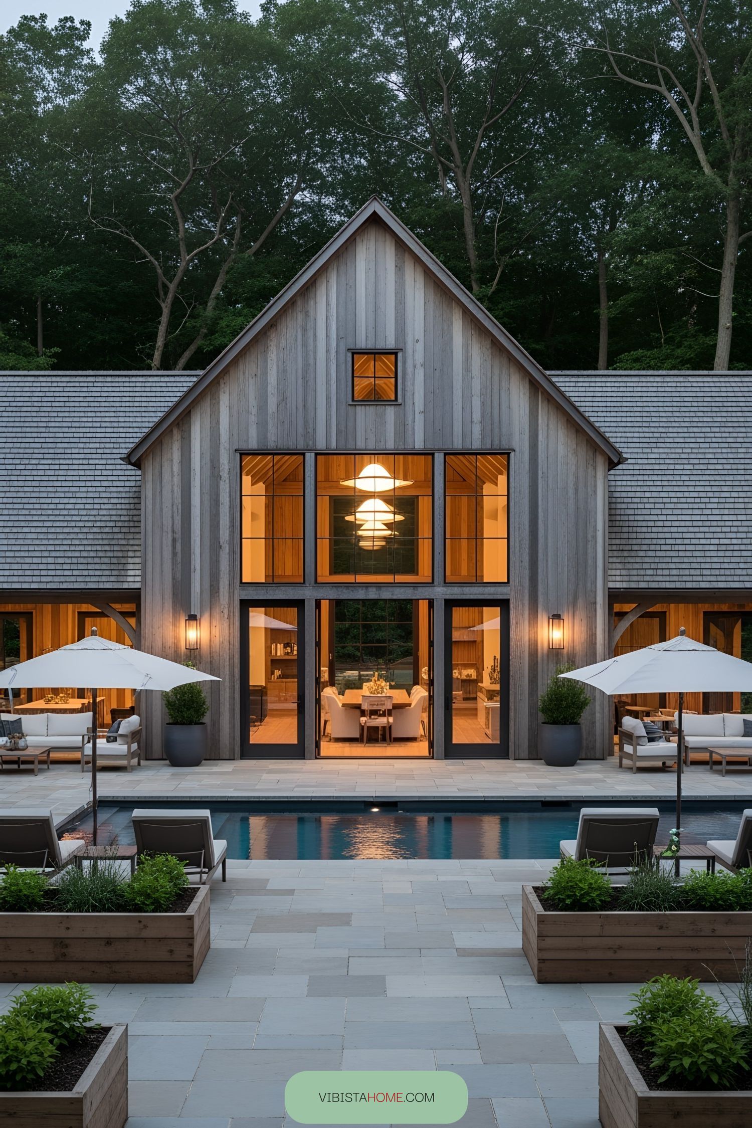 Modern barn house exterior with a pool